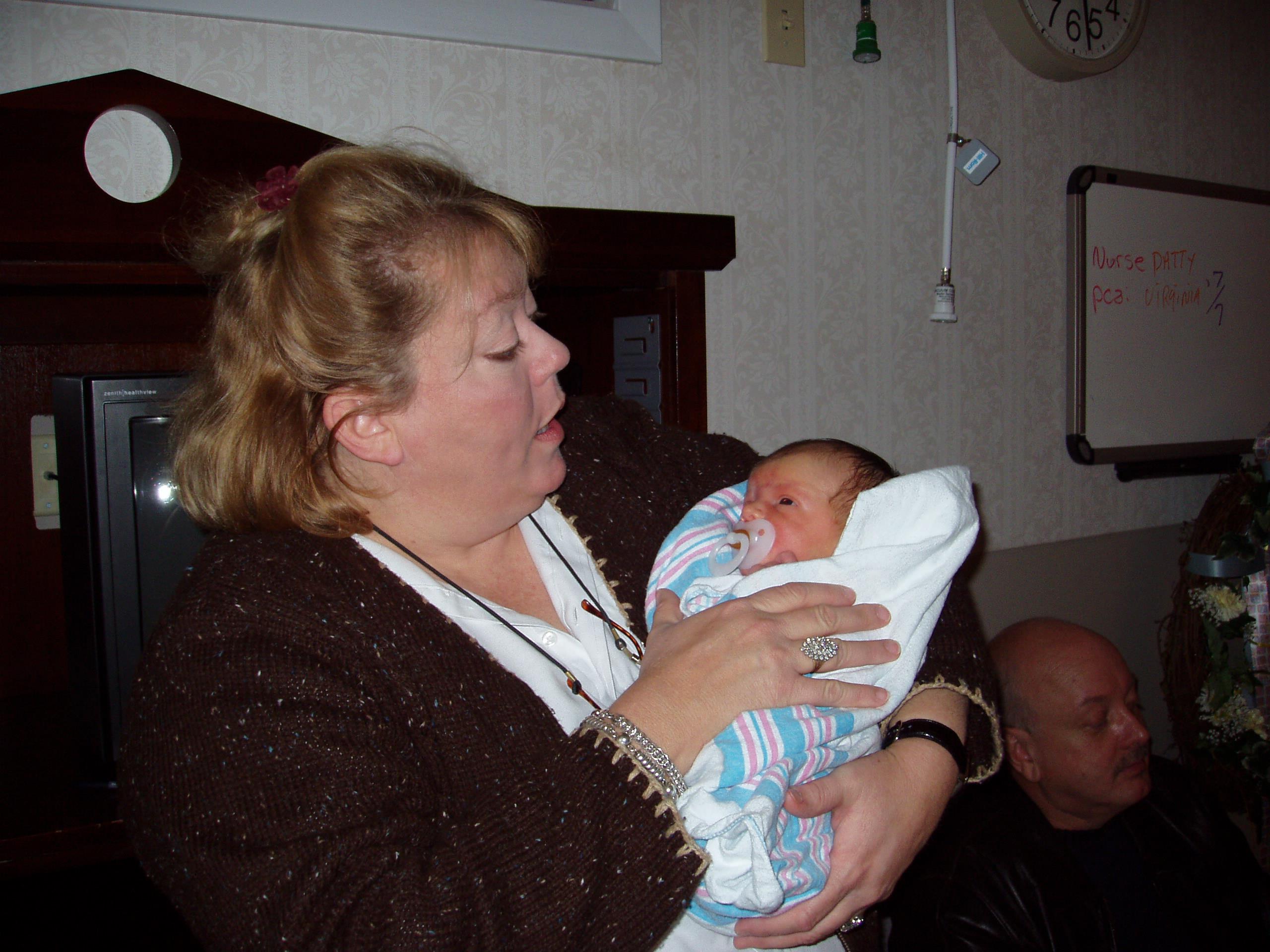 A woman holding a baby
