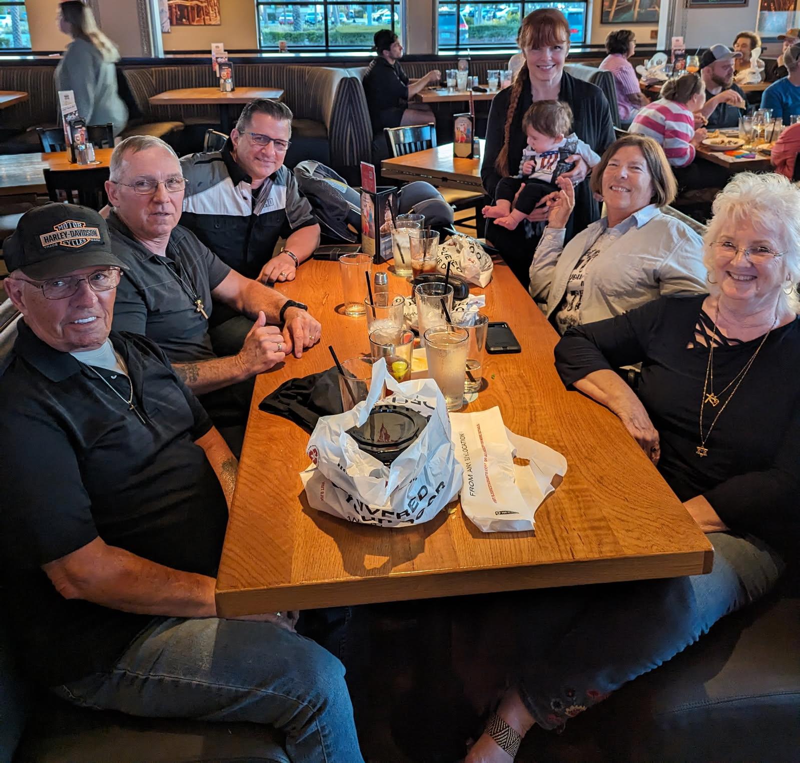 A group of people sitting at a table