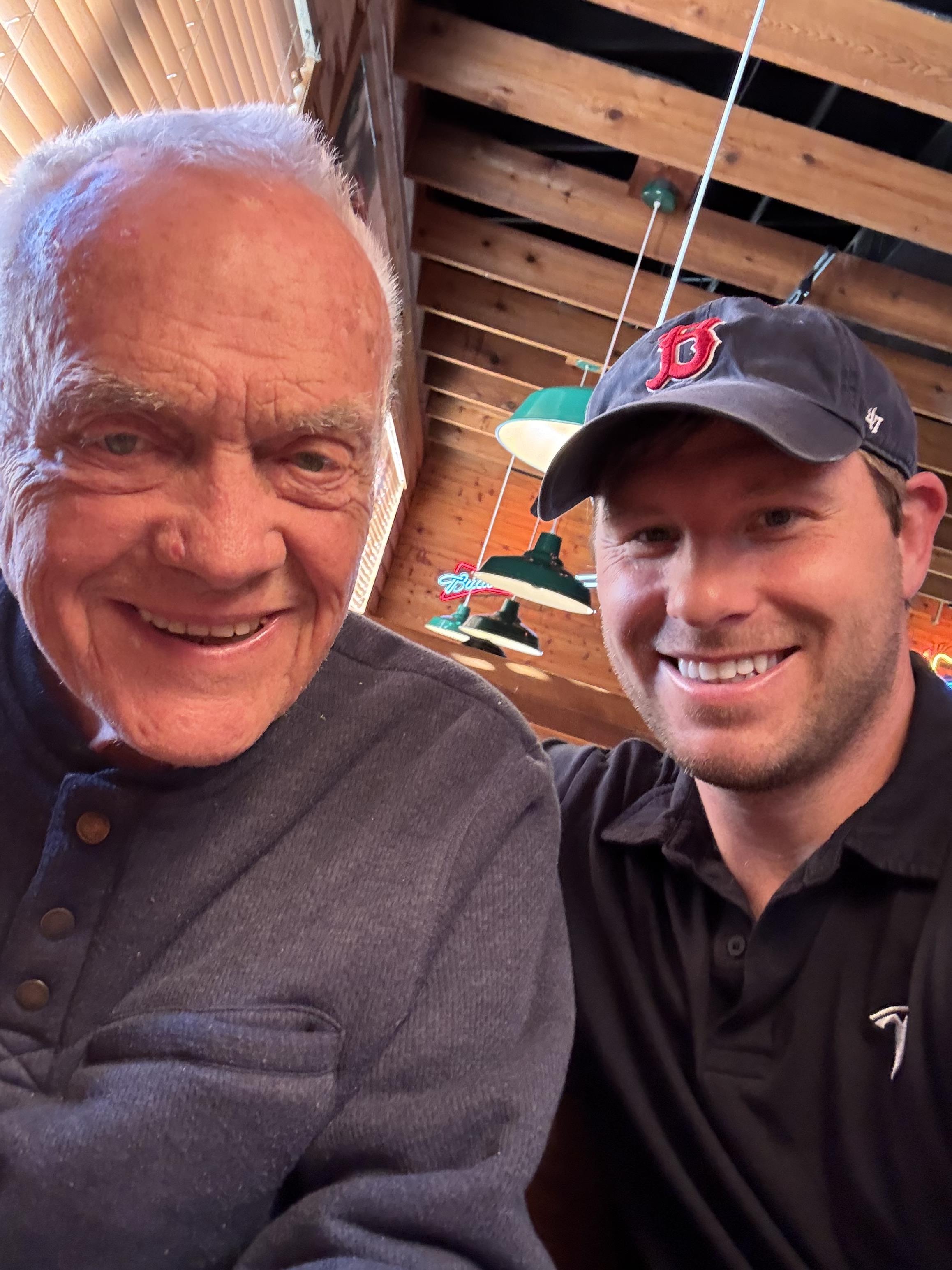 A man and a man smiling