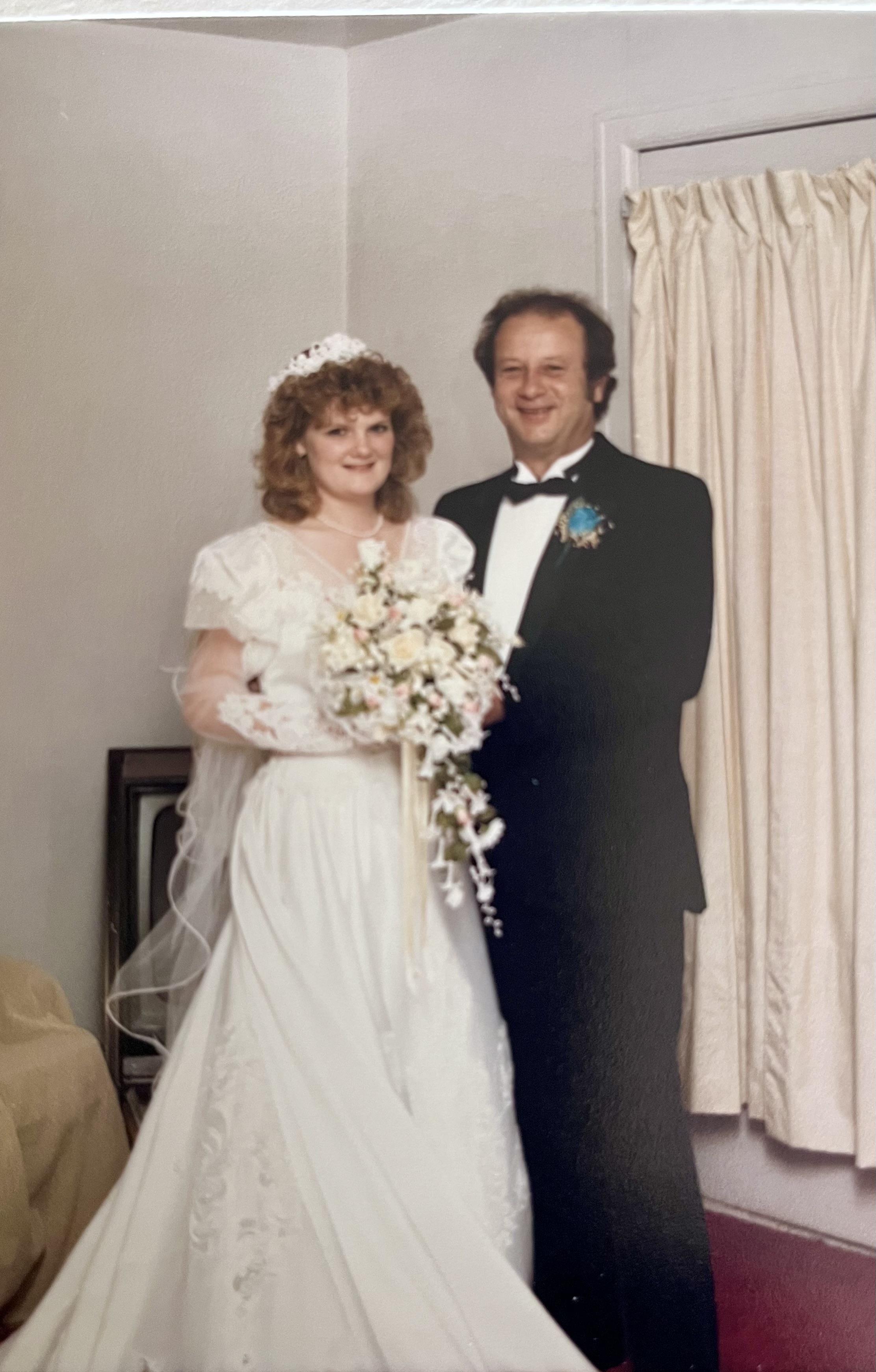 A man and woman in wedding attire