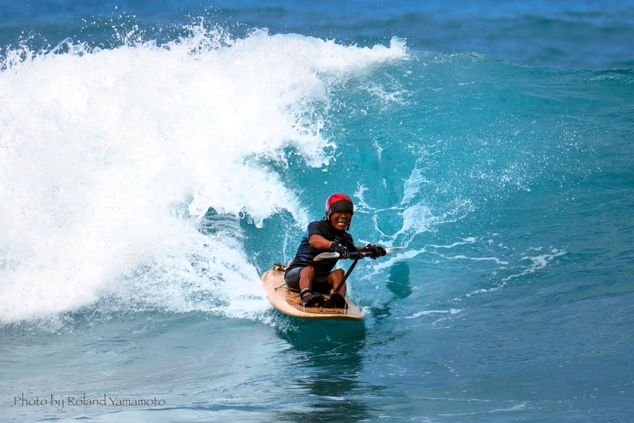 A person on a surfboard in the ocean