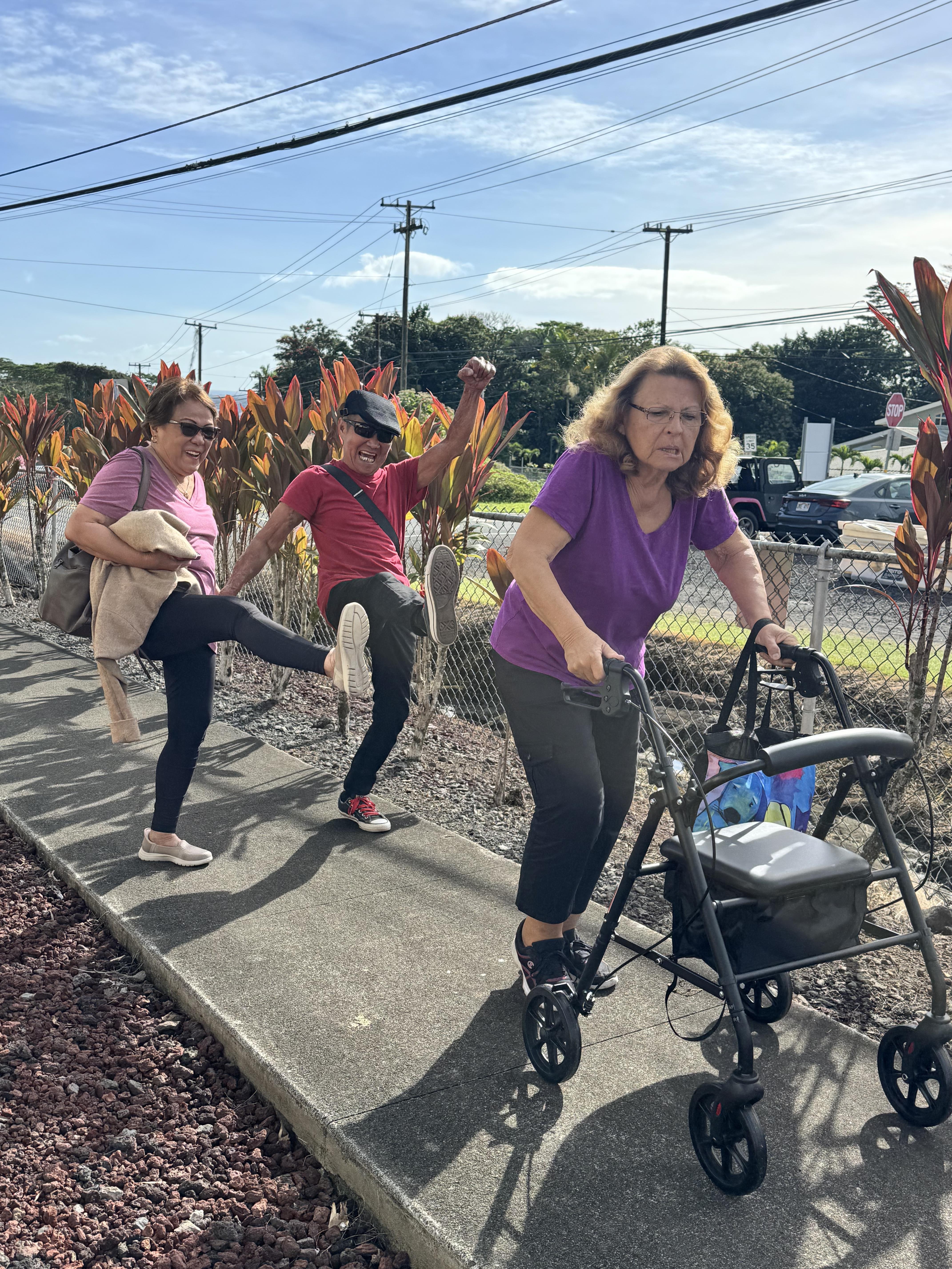 A group of women pushing a walker