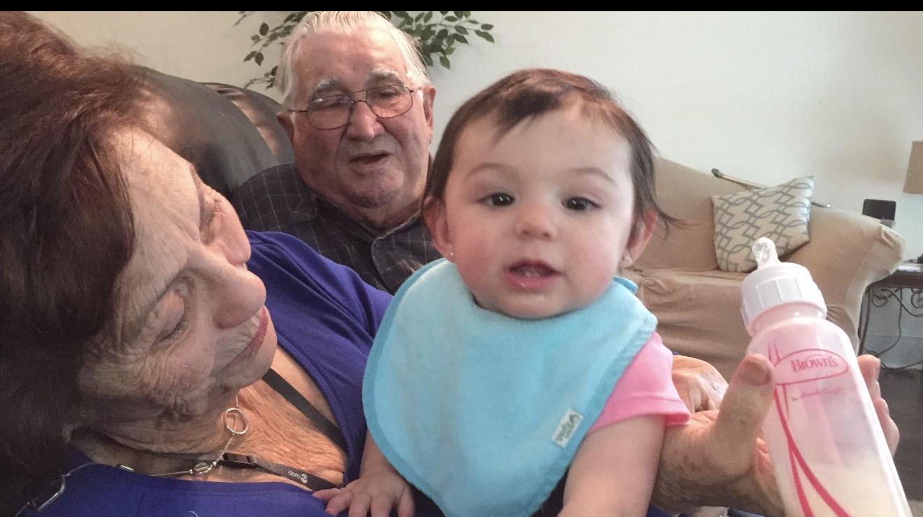 A man and woman with a baby