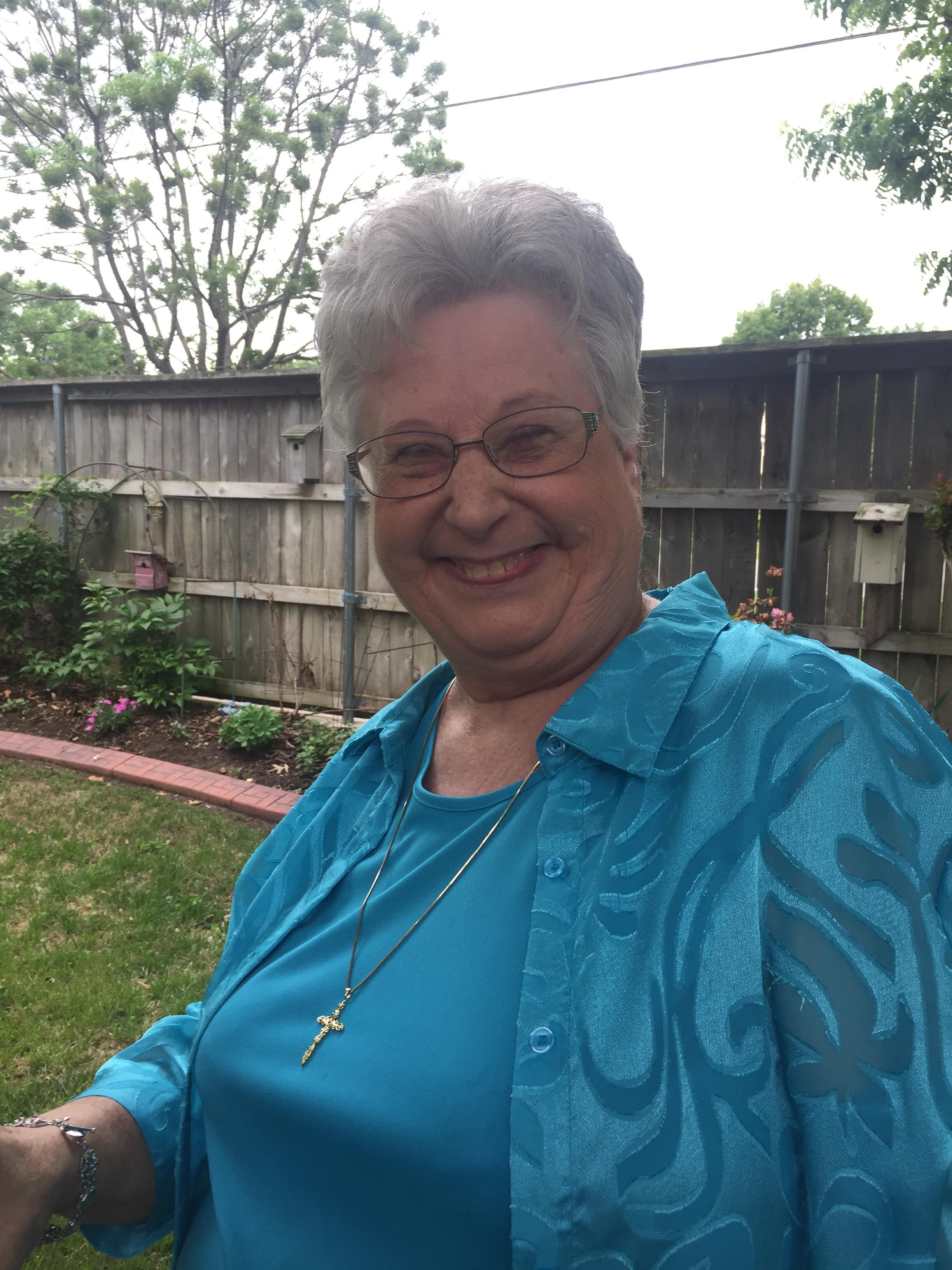 A woman smiling at the camera