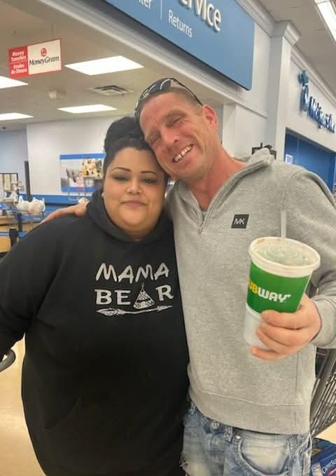 A man and woman posing for a picture