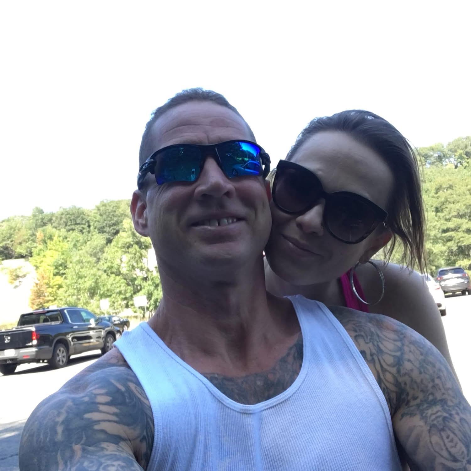 A man and woman taking a selfie