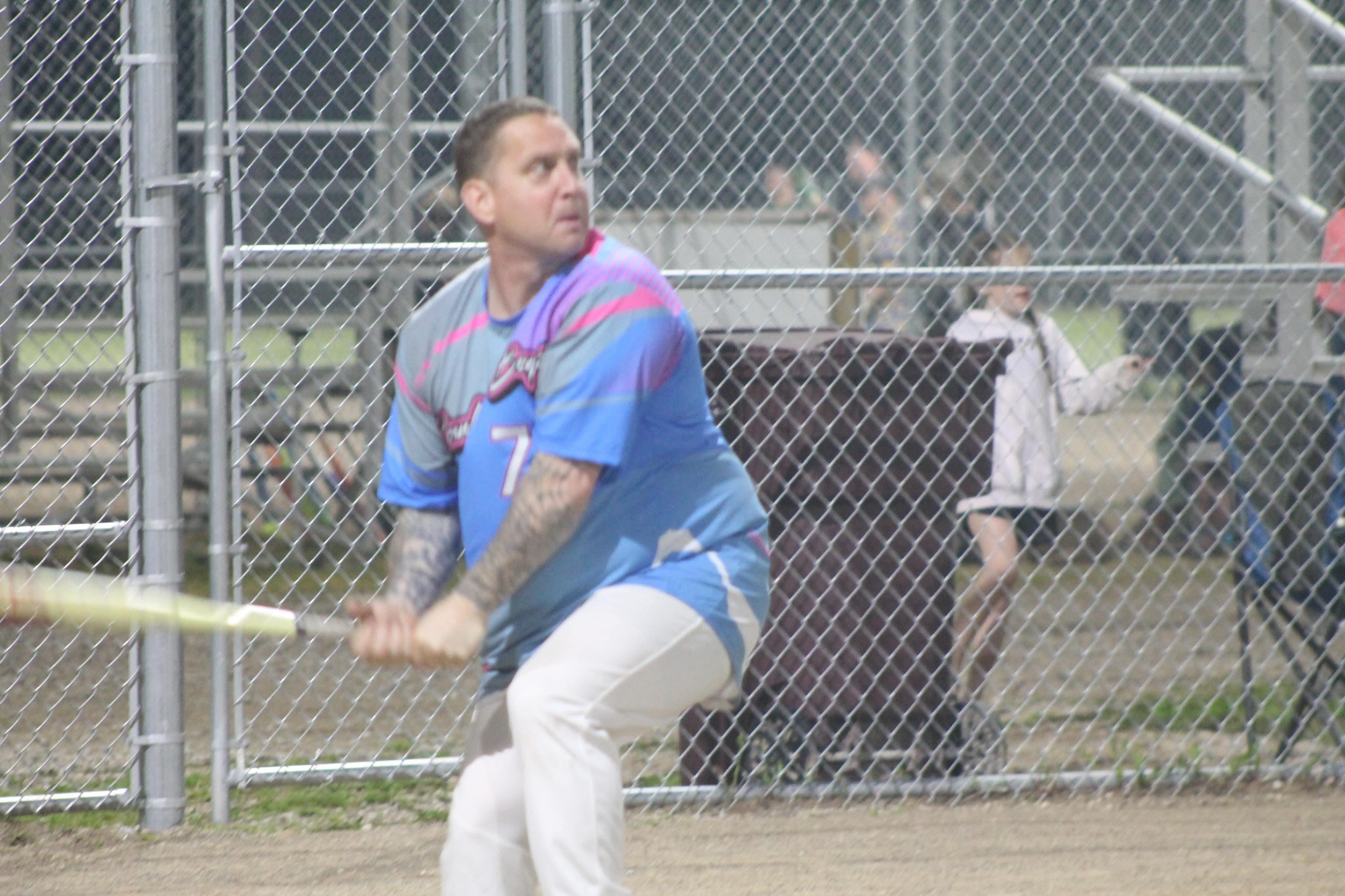 A man swinging a baseball bat