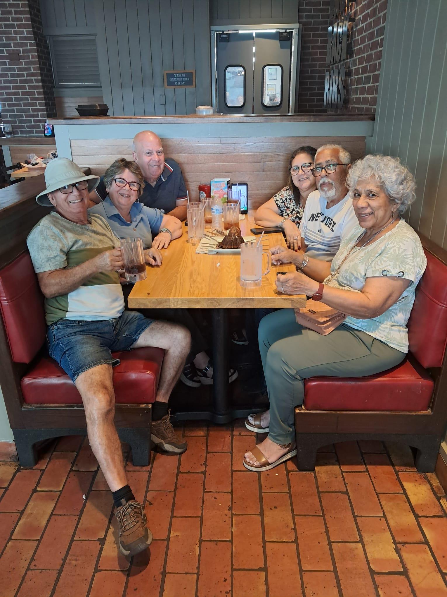 A group of people sitting at a table