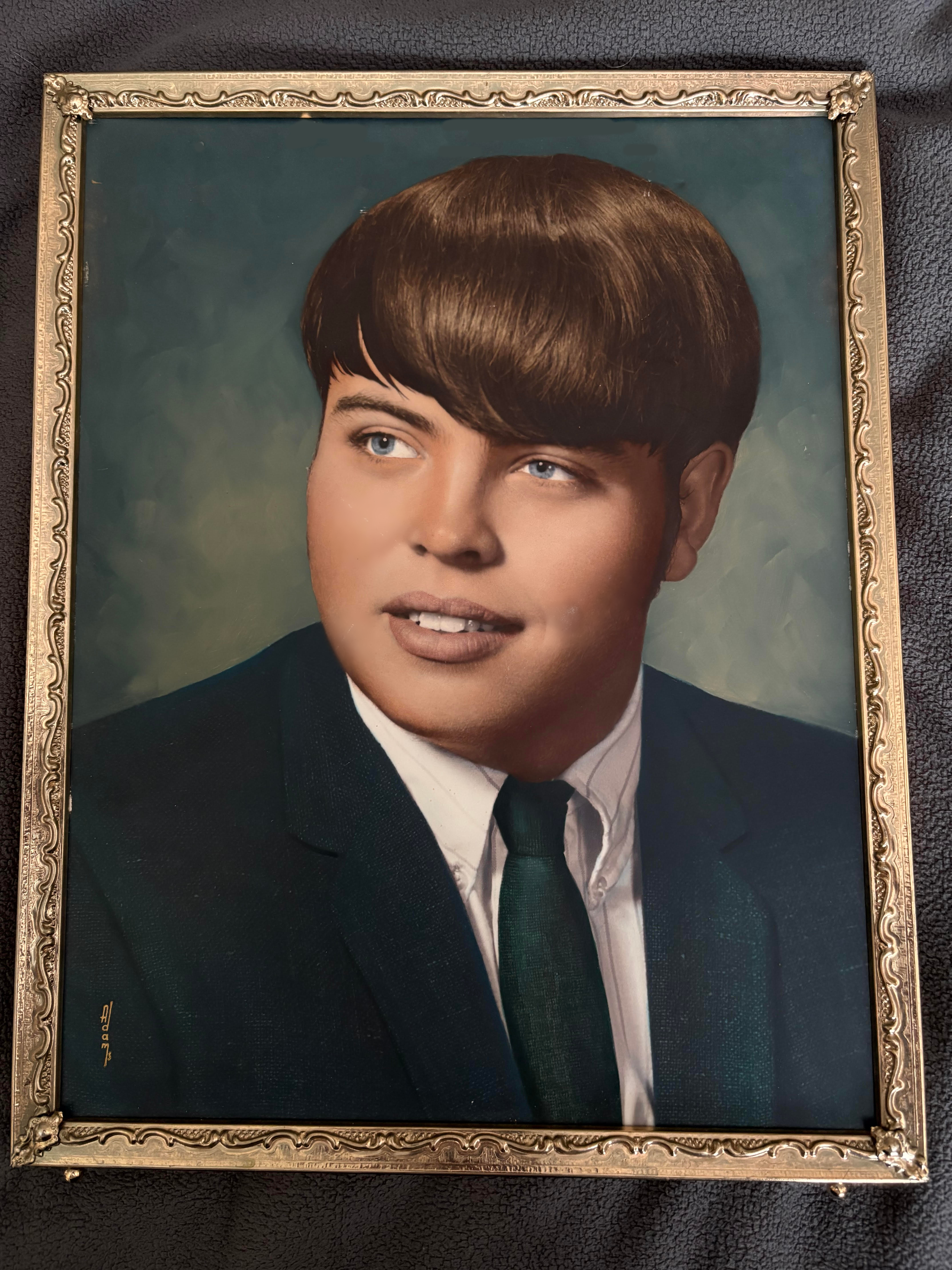 A framed picture of a boy