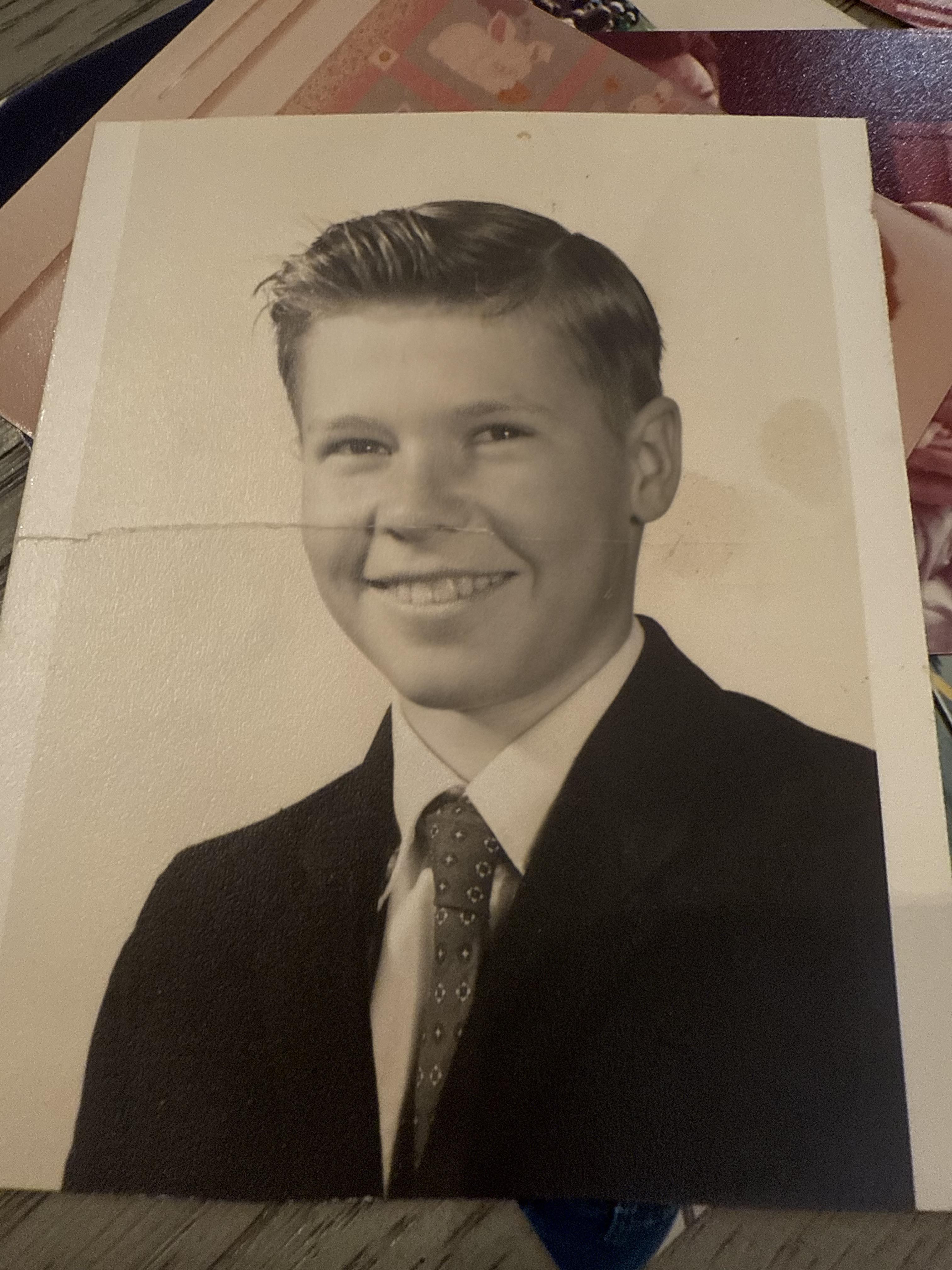 A black and white photo of a boy