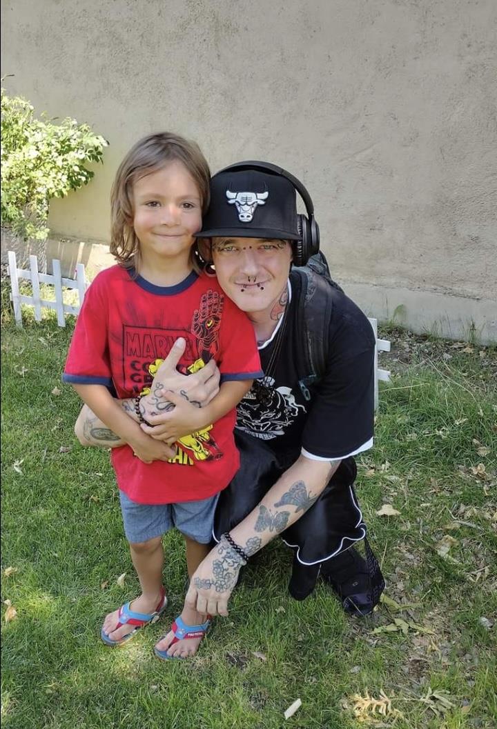 A man and child posing for a picture