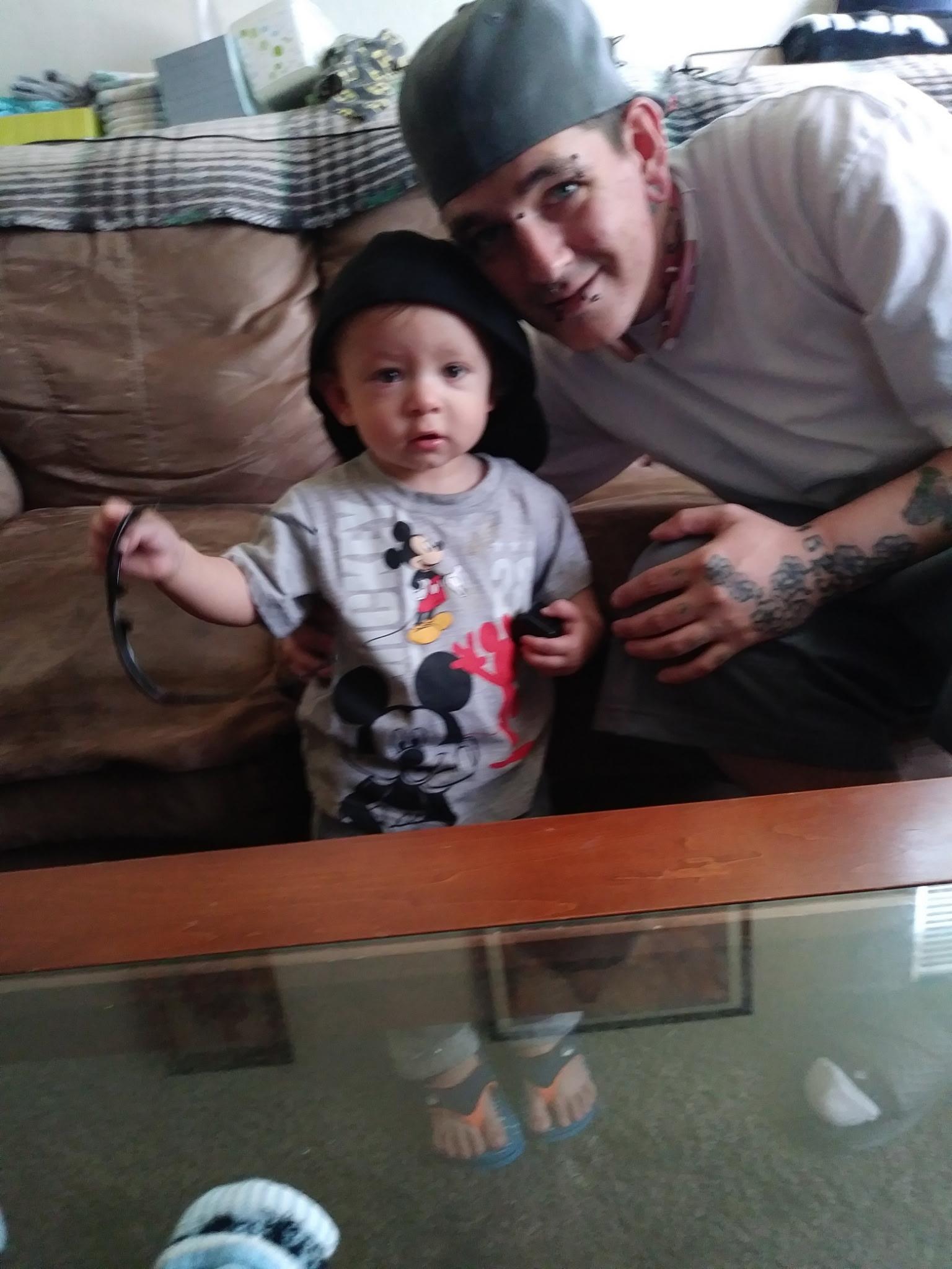 A man and child posing for a picture