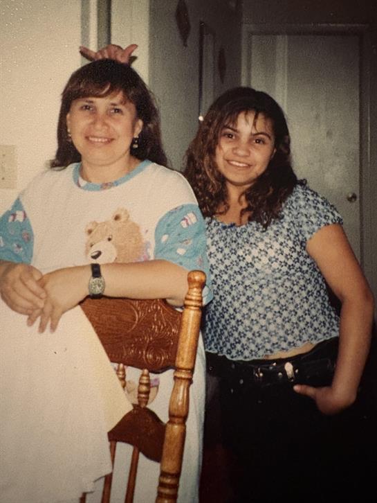Two women standing next to each other