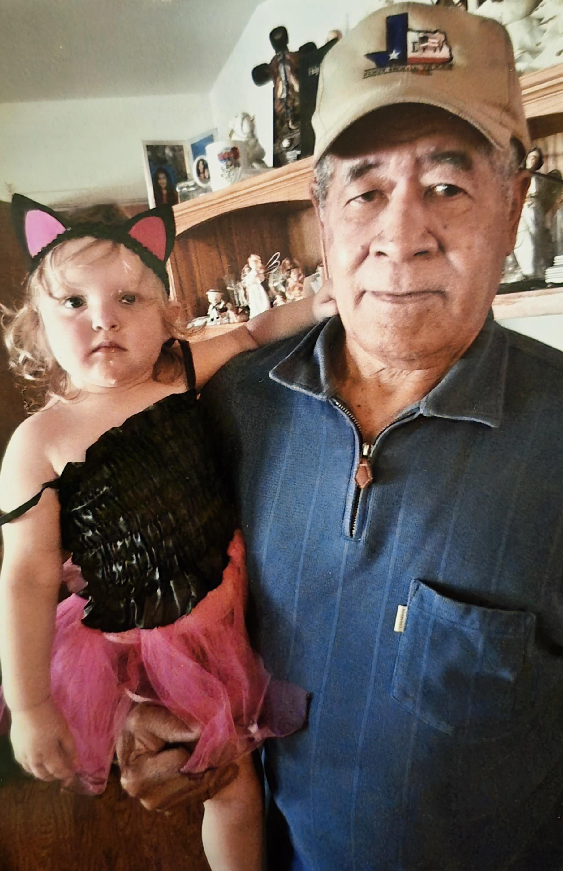 A man and a child posing for a picture