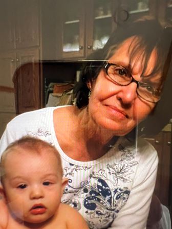 A woman holding a baby