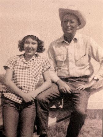 A man and woman posing for a picture