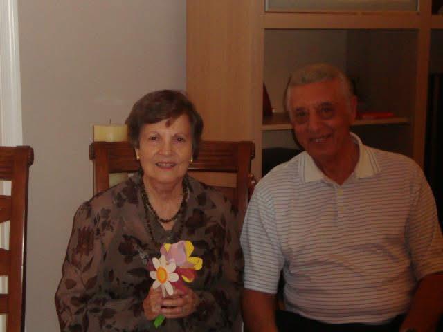 A man and woman sitting in a chair