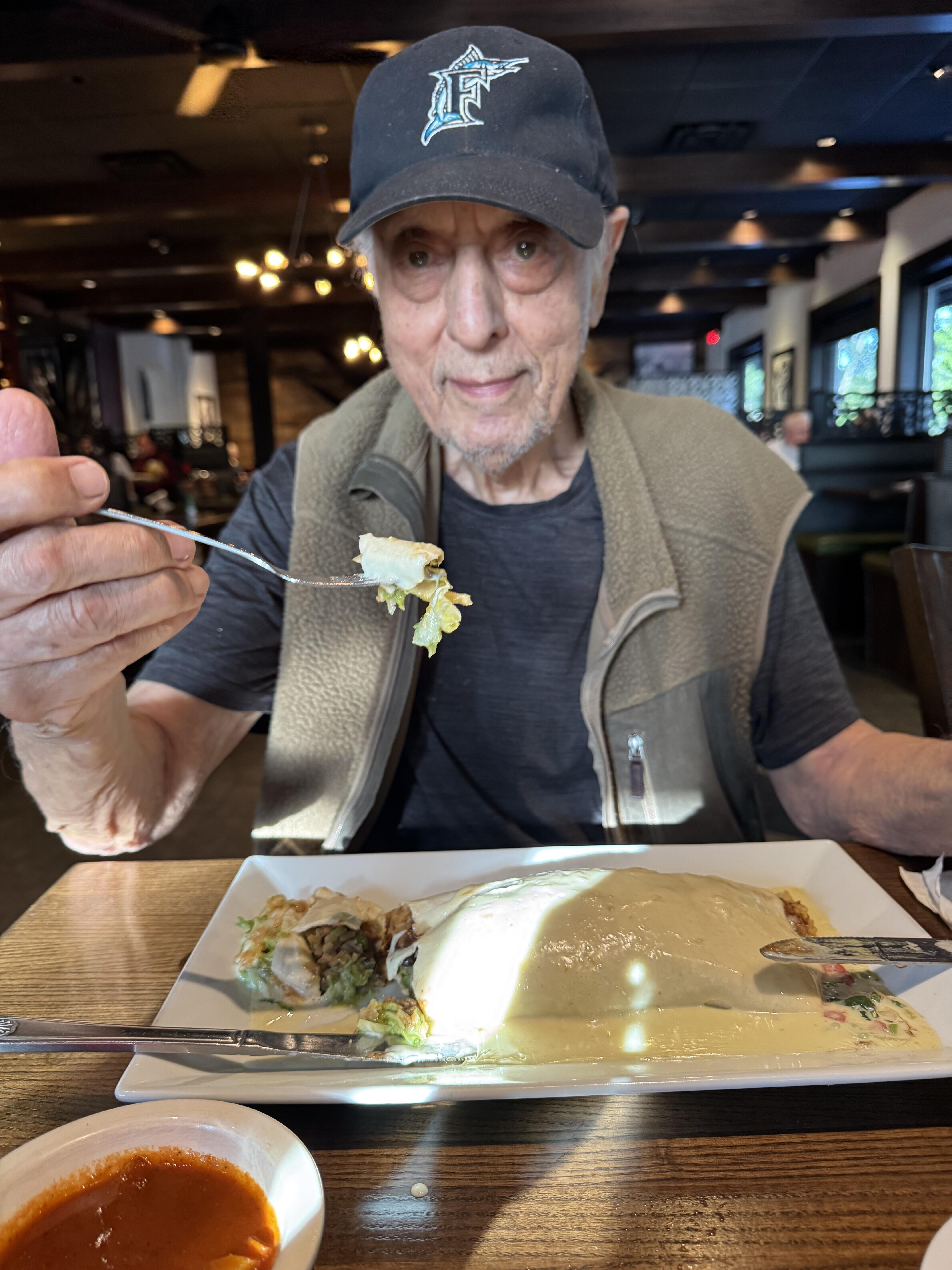 A man eating food at a restaurant