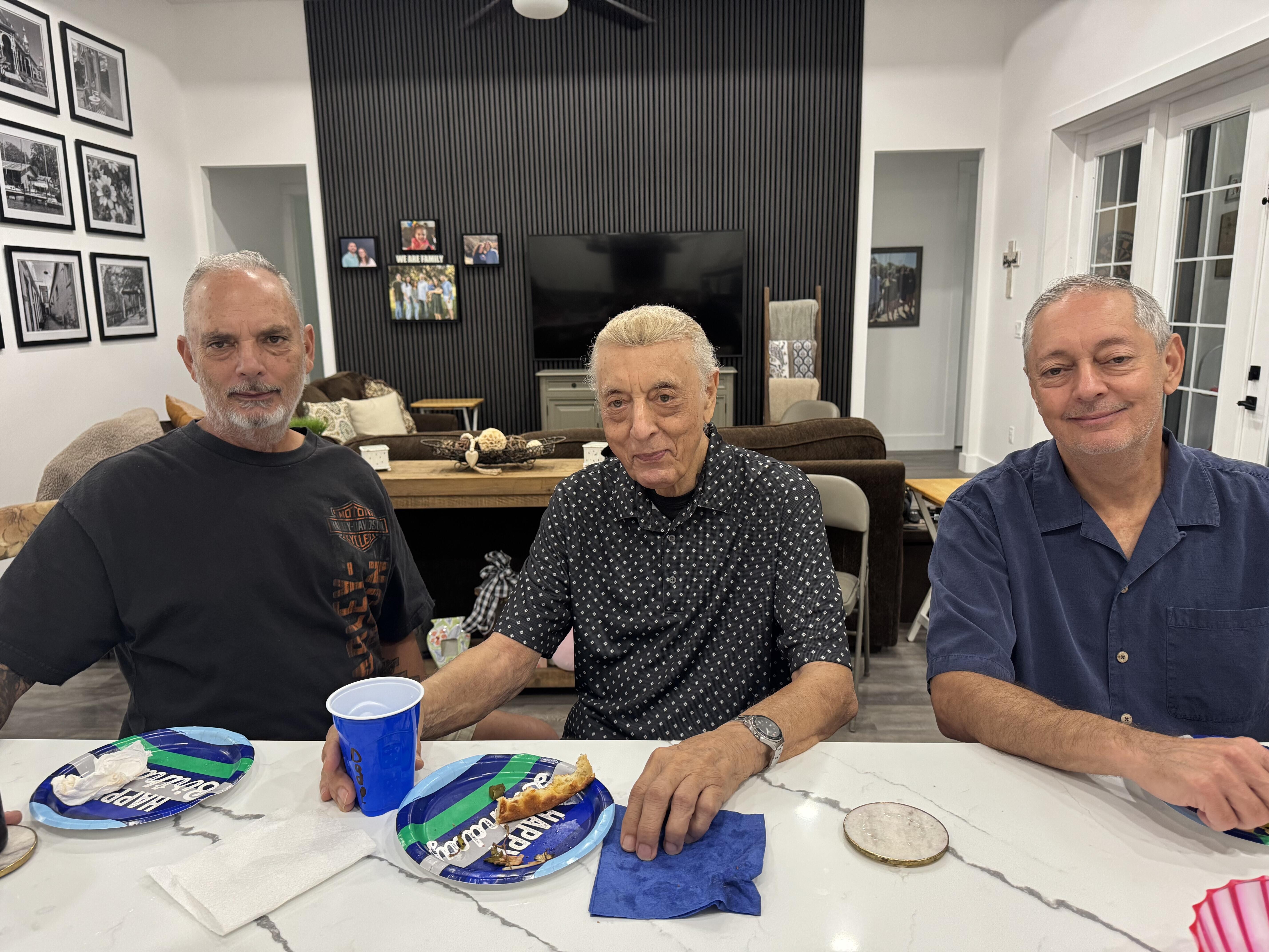 A group of men sitting at a table