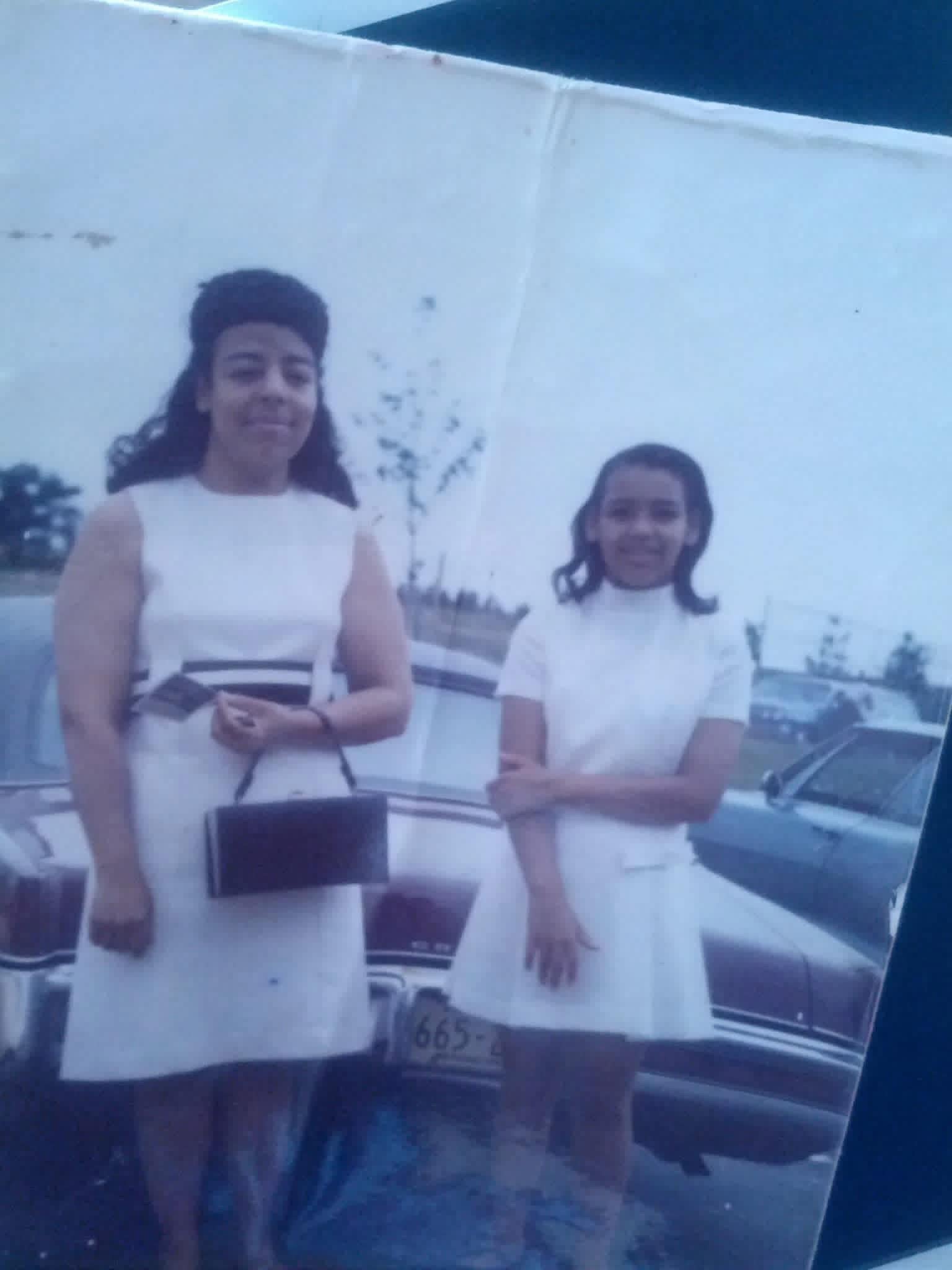 Two women in white dresses