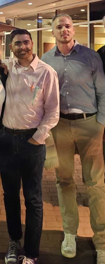 Two men standing together