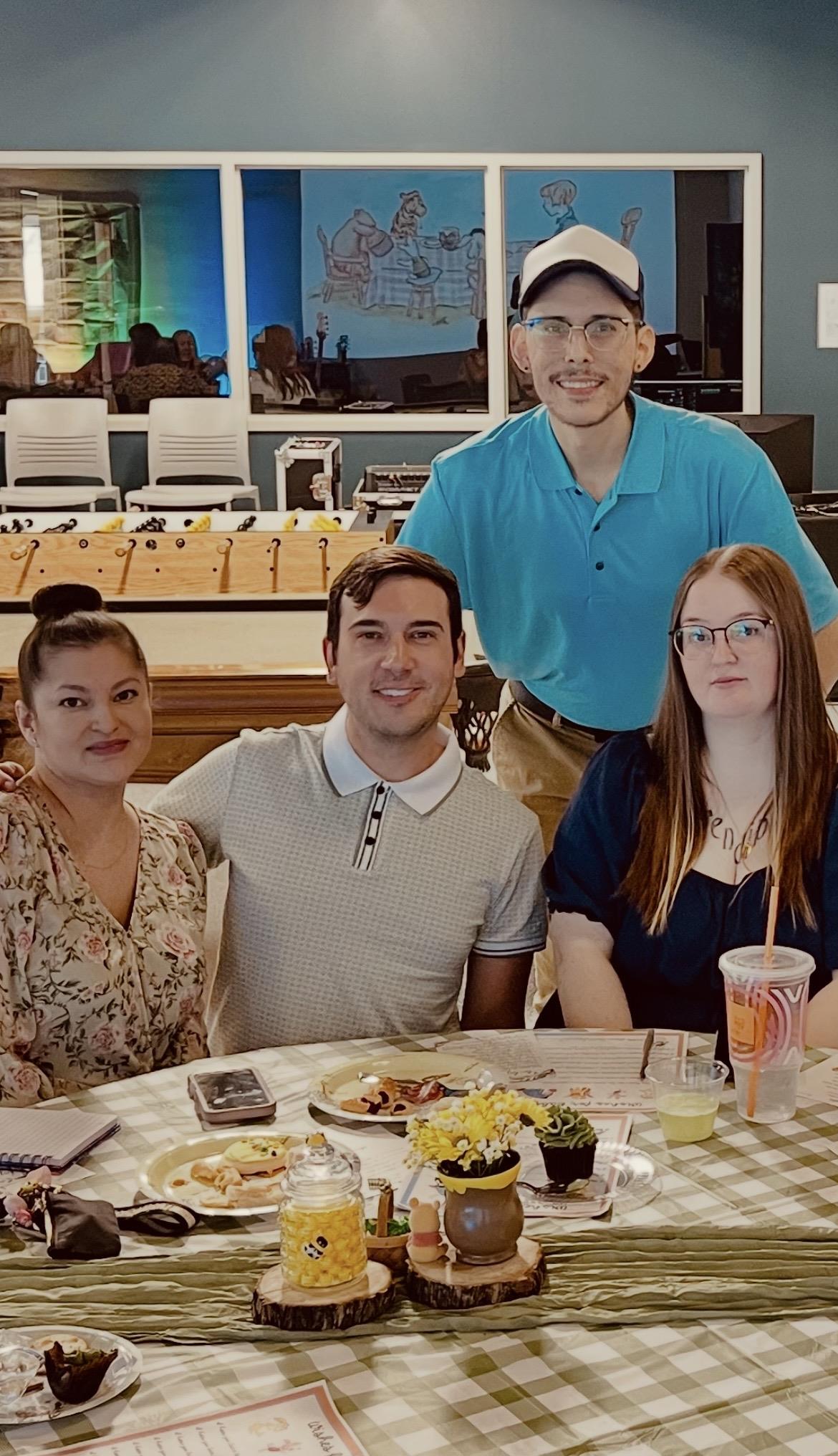 A group of people sitting at a table