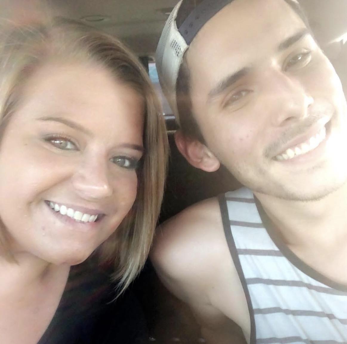 A man and woman taking a selfie
