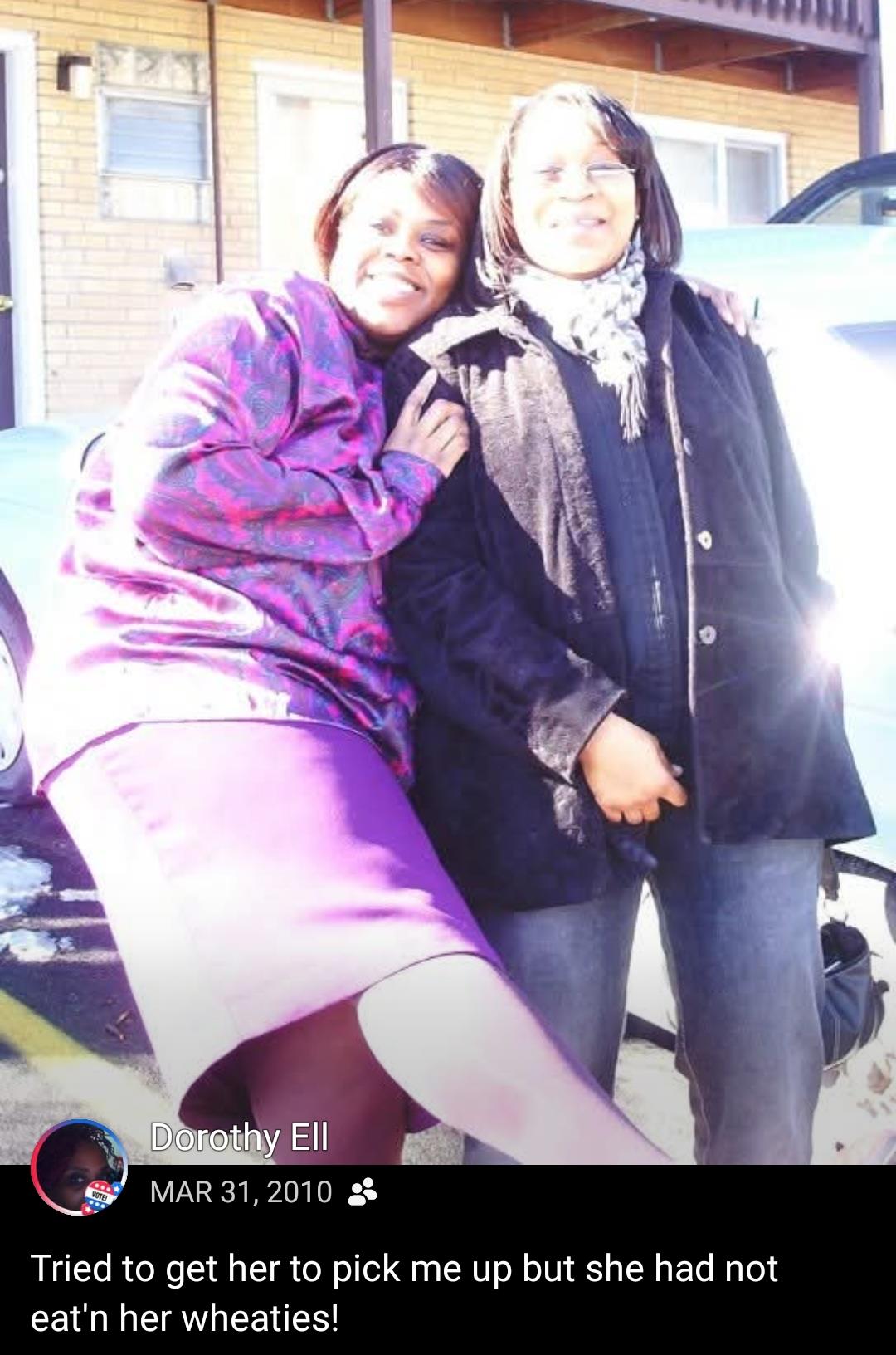Two women standing together smiling