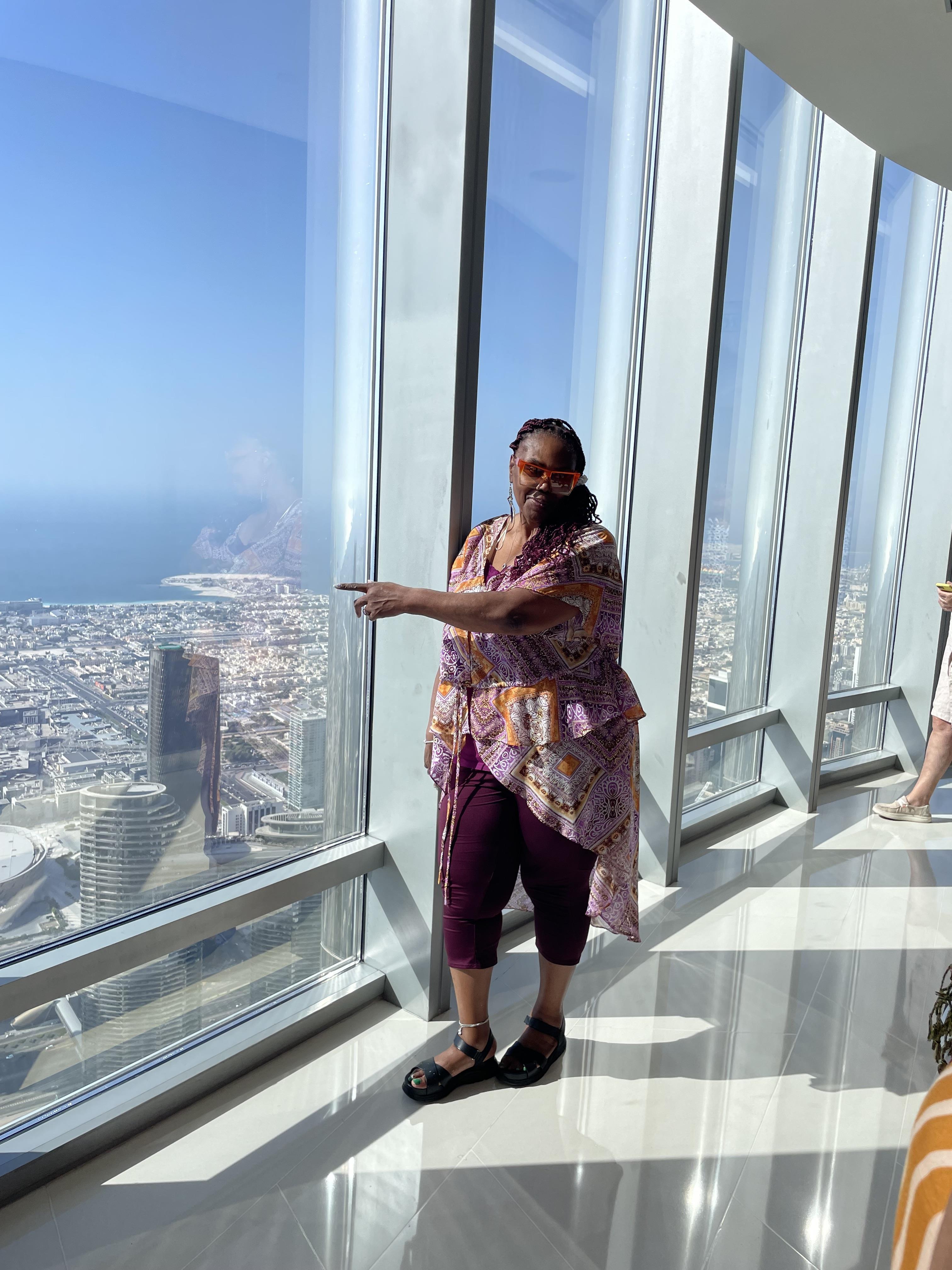A woman pointing at a window