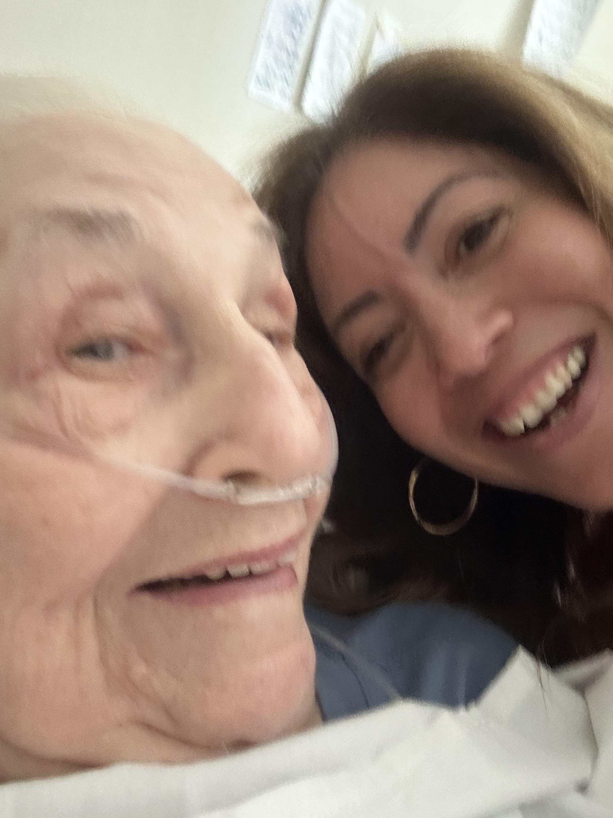A woman taking a selfie with a man