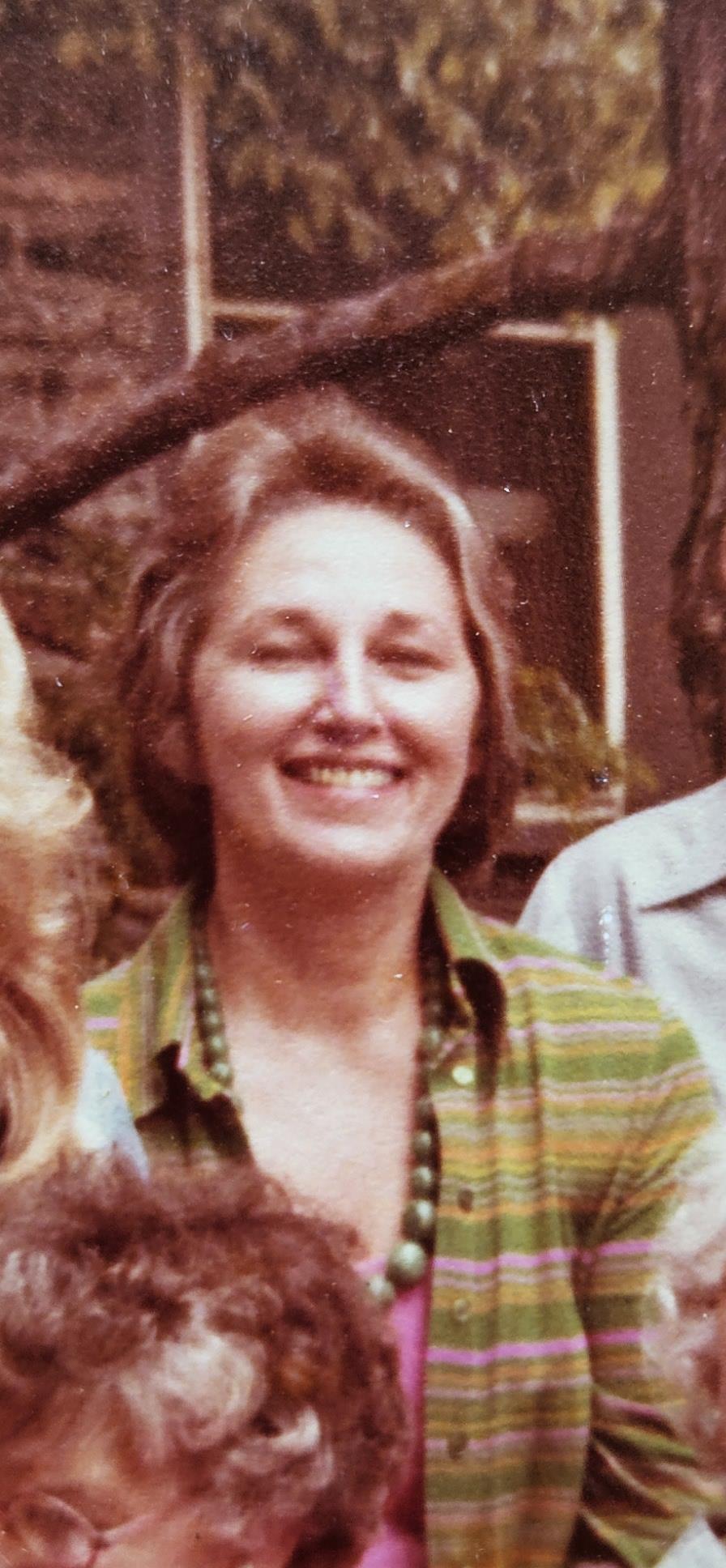 A woman smiling at the camera