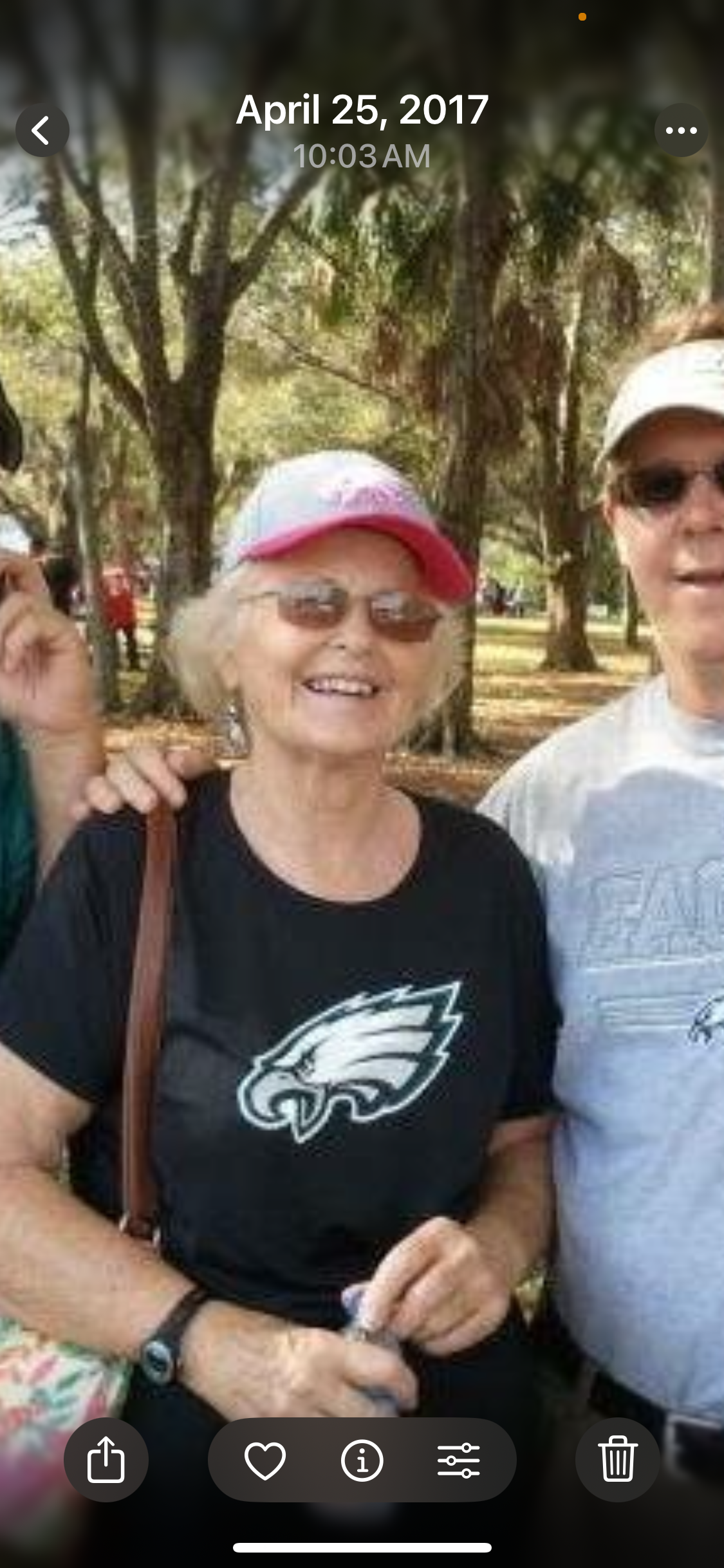 A woman wearing a hat and sunglasses