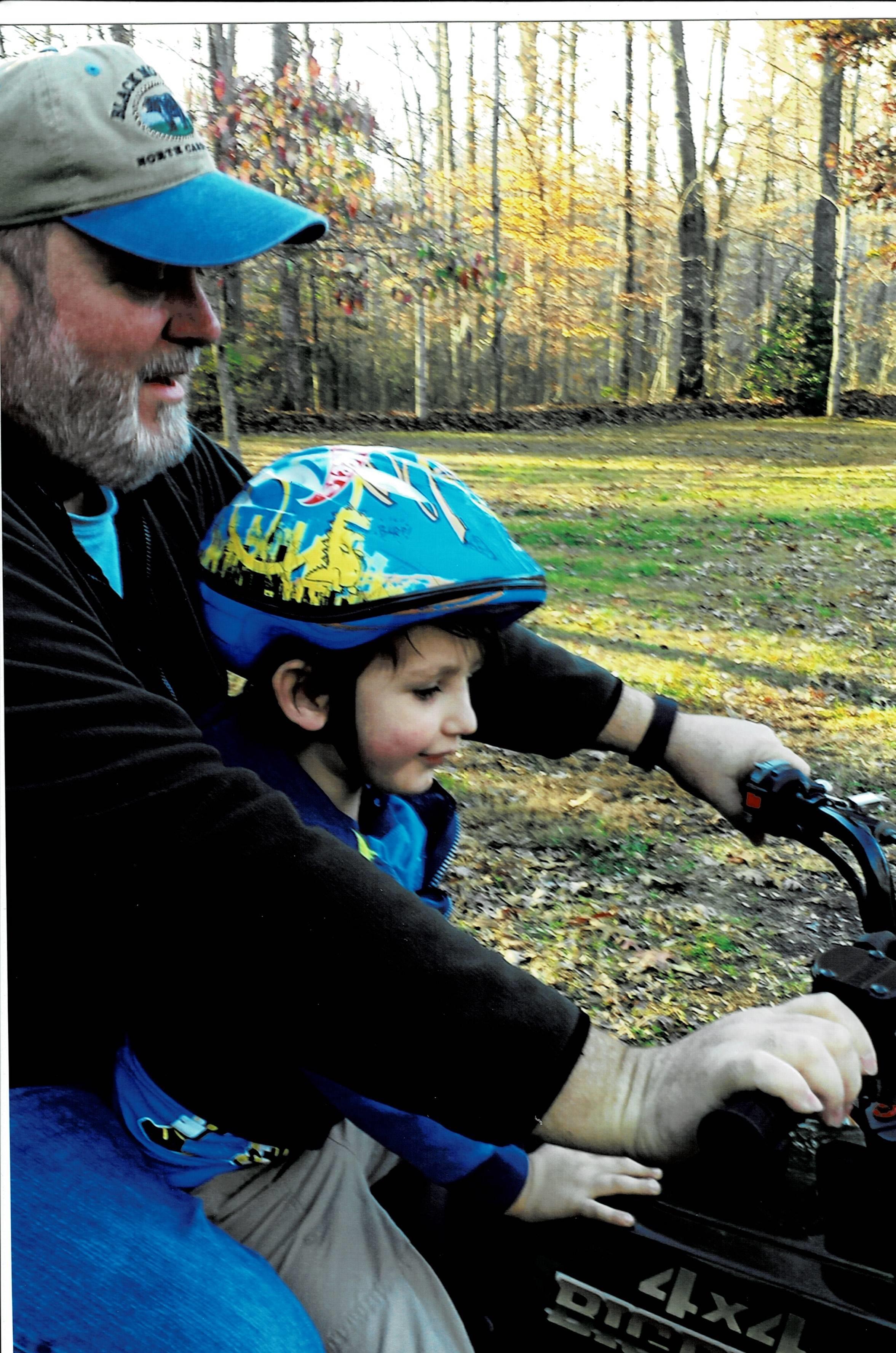 A man and child on a bike