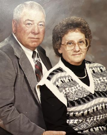 A man and woman posing for a picture