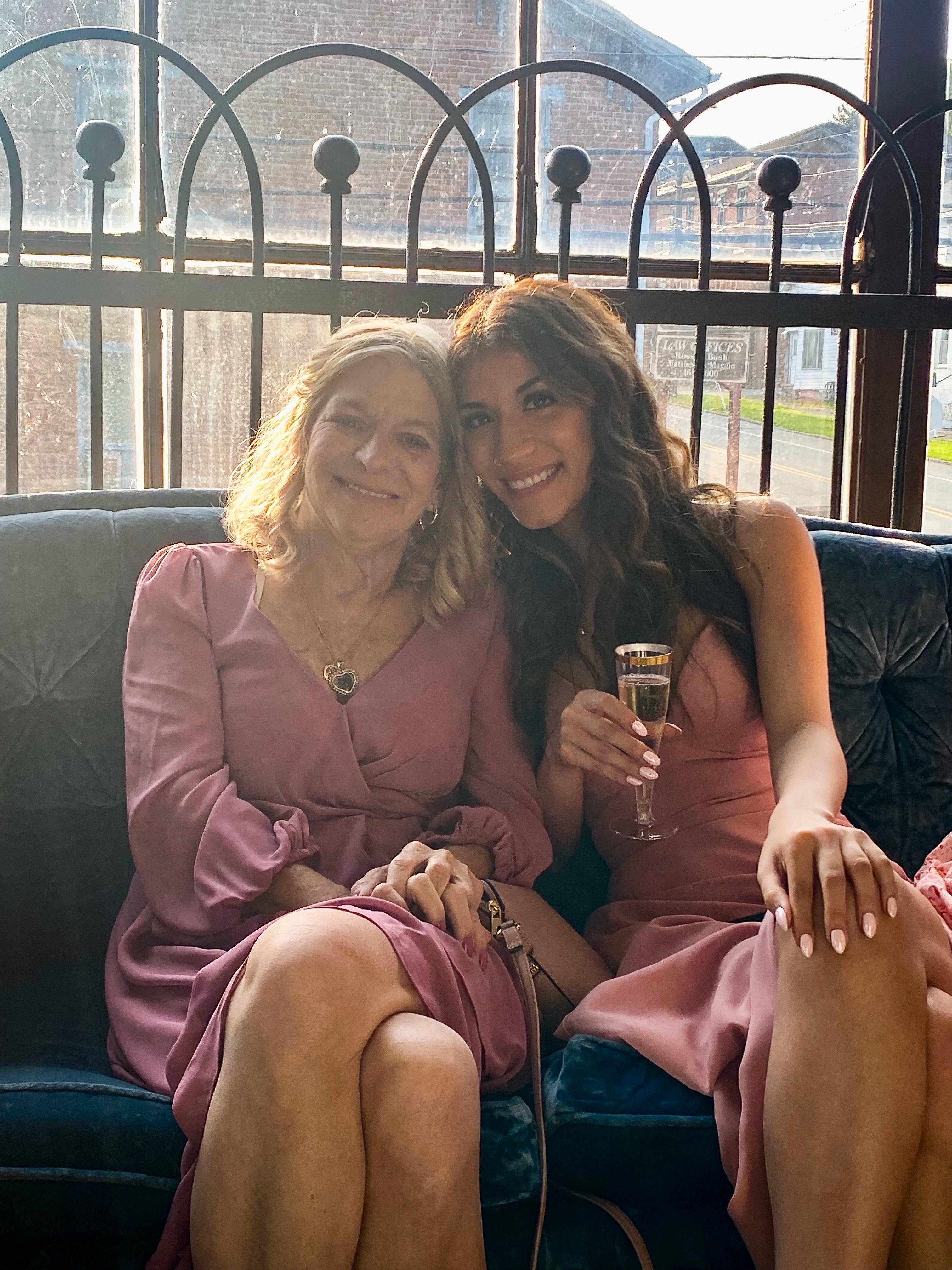 Two women sitting on a couch