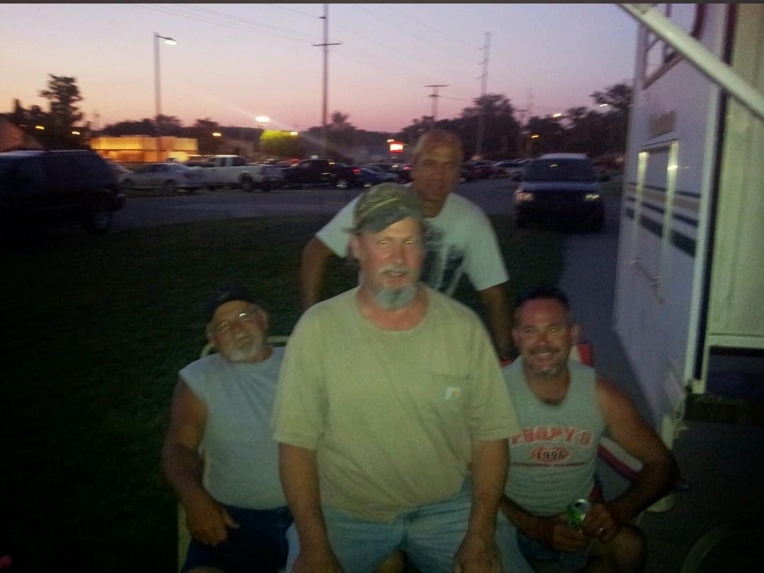 A group of men sitting in a truck