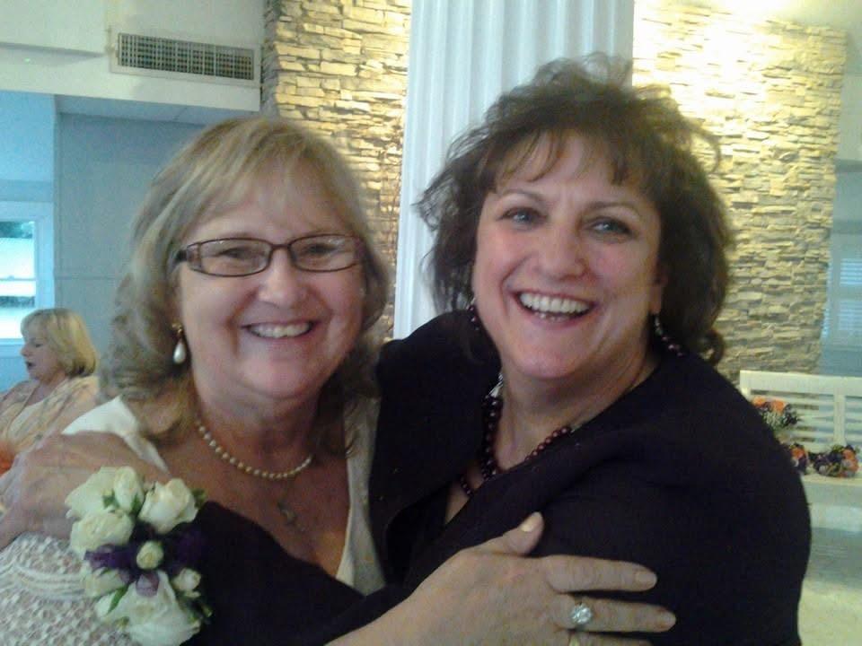 Two women smiling at the camera