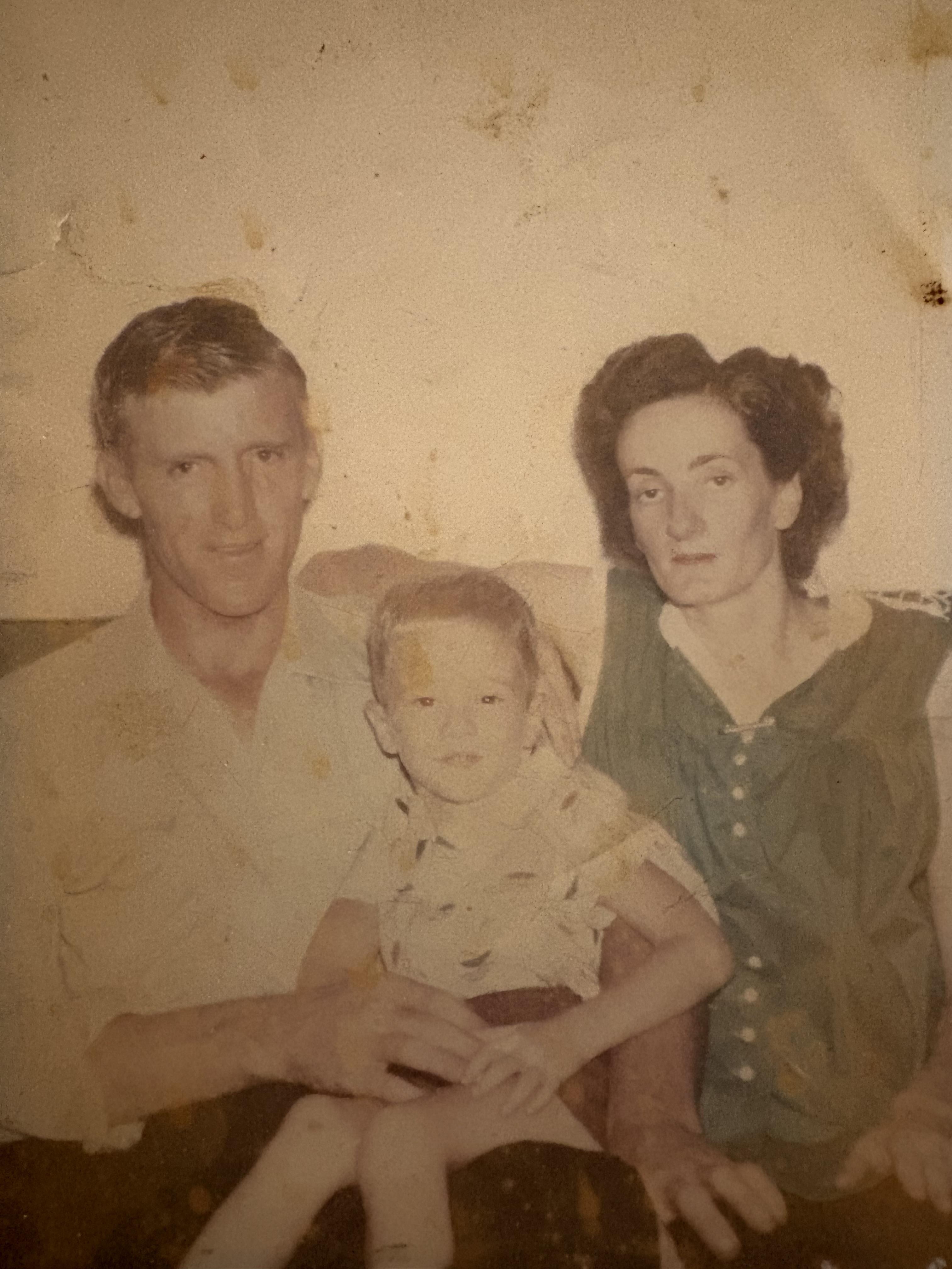A man and woman with a child