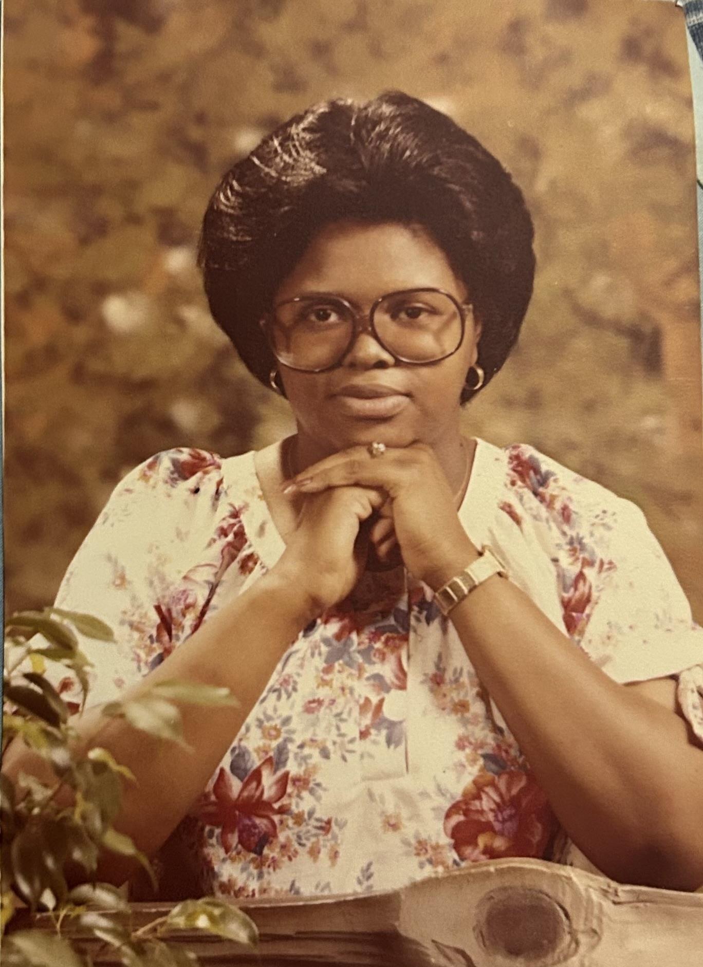 A woman with her hands together
