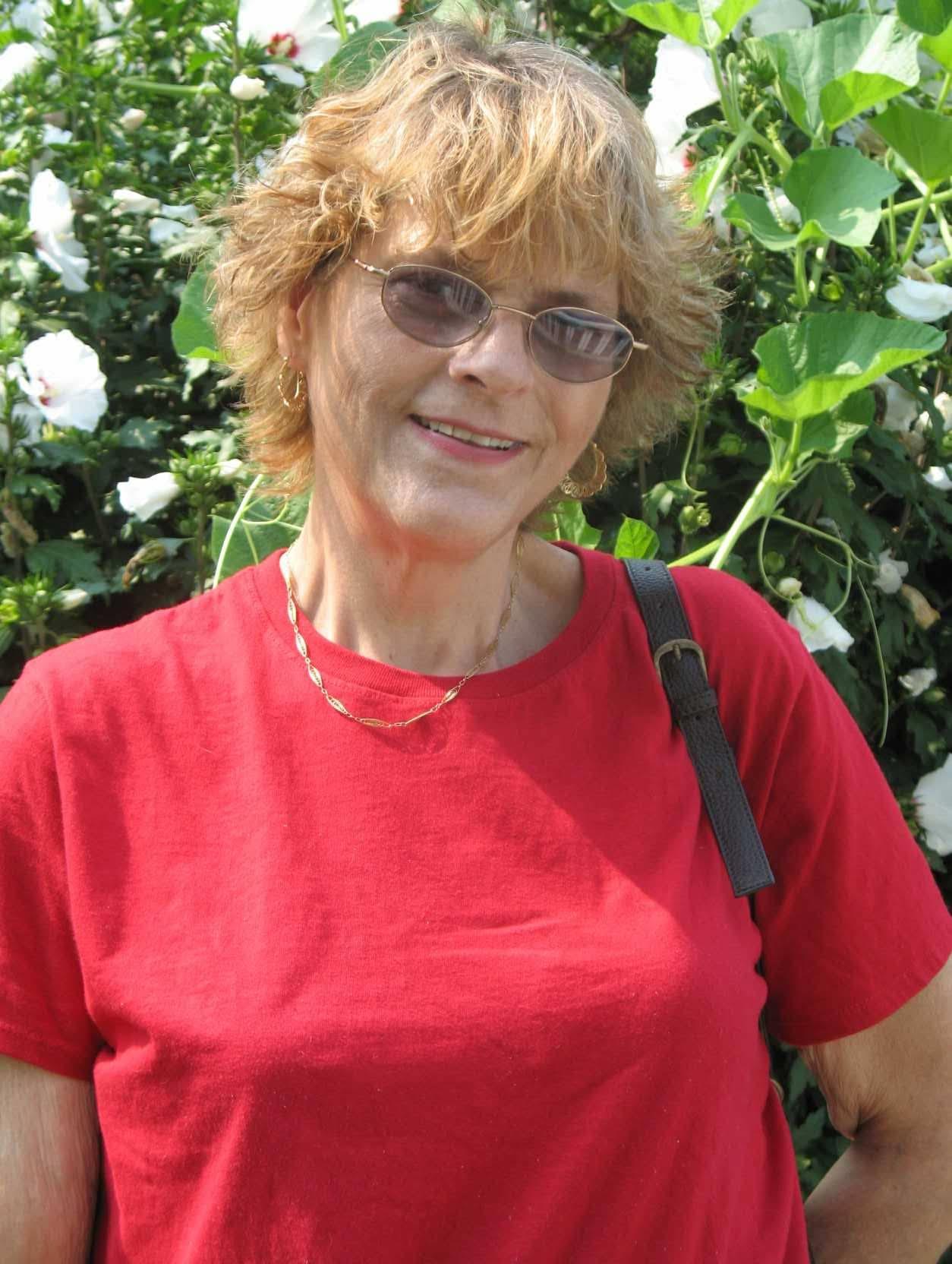 A woman in a red shirt