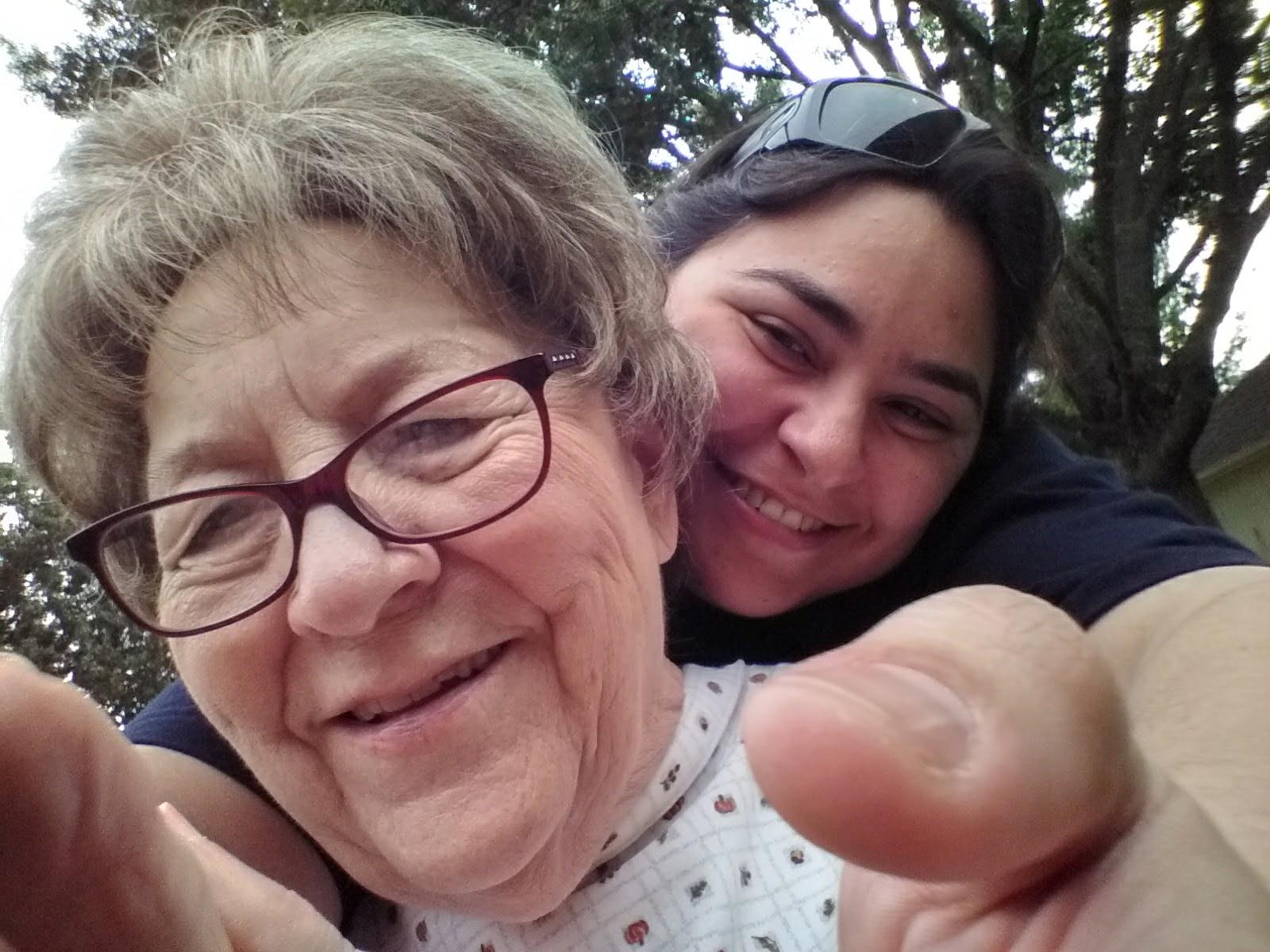 A woman and a young woman taking a selfie