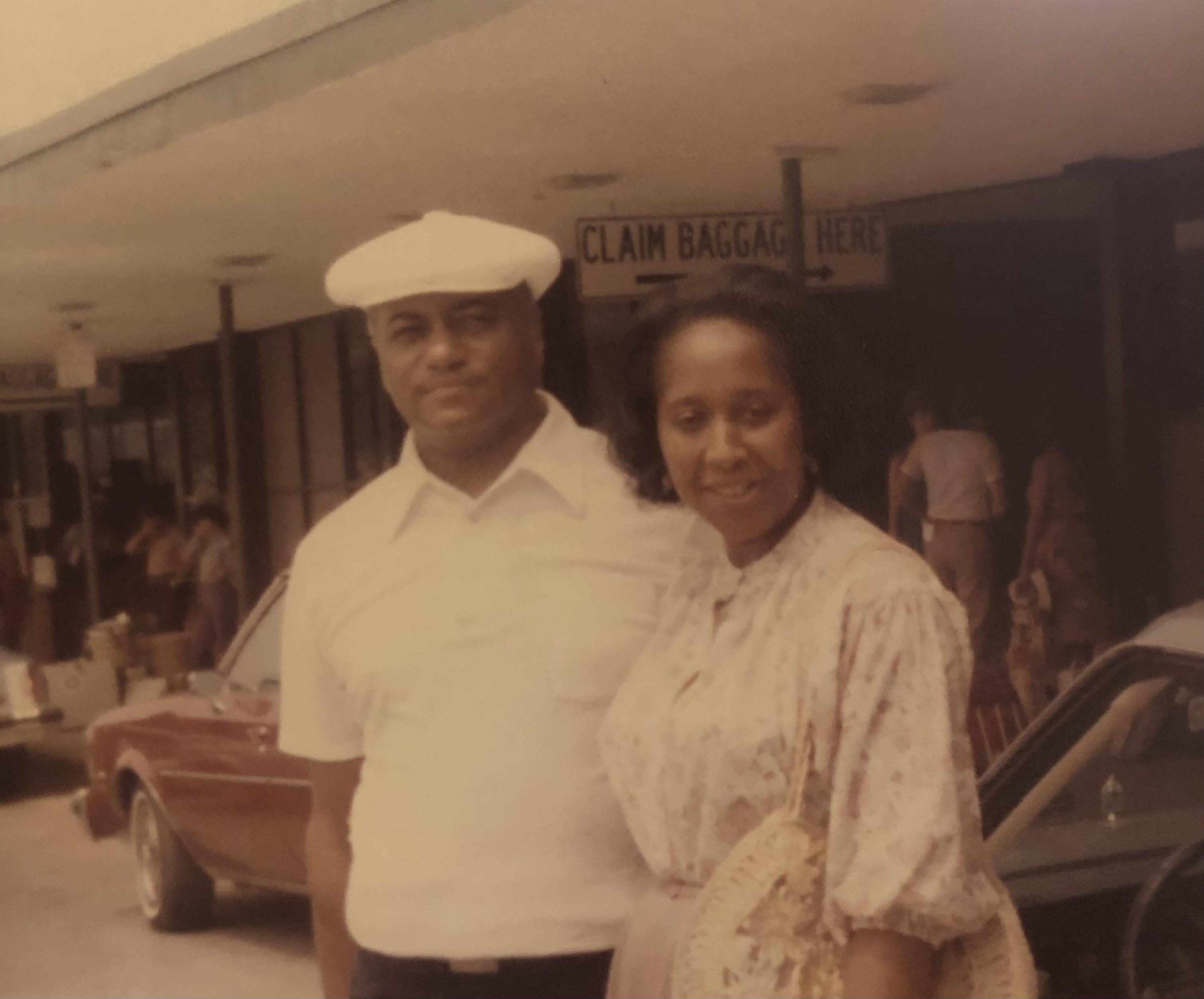 A man and woman standing outside a building