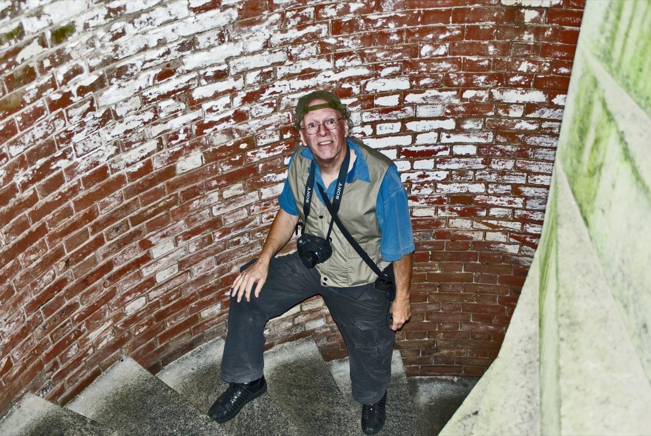 A man standing on a brick staircase