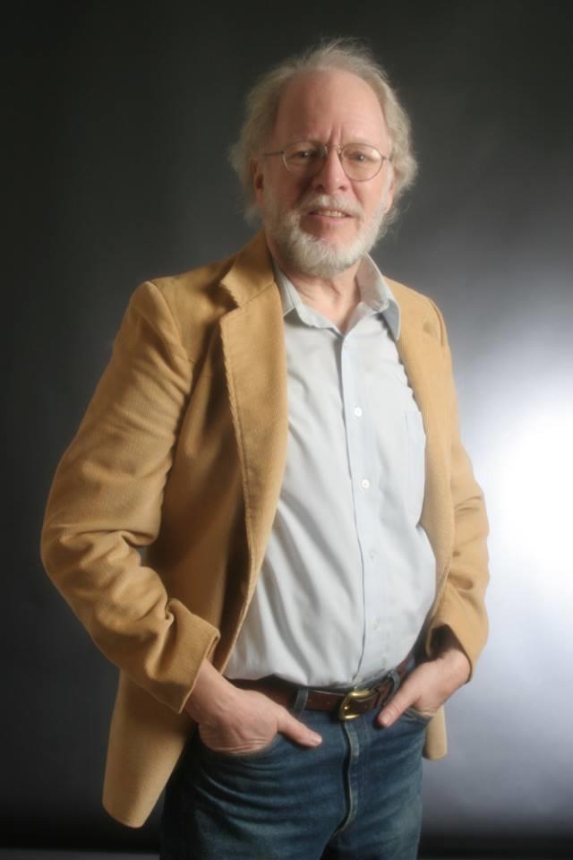 A man with a beard and a white beard