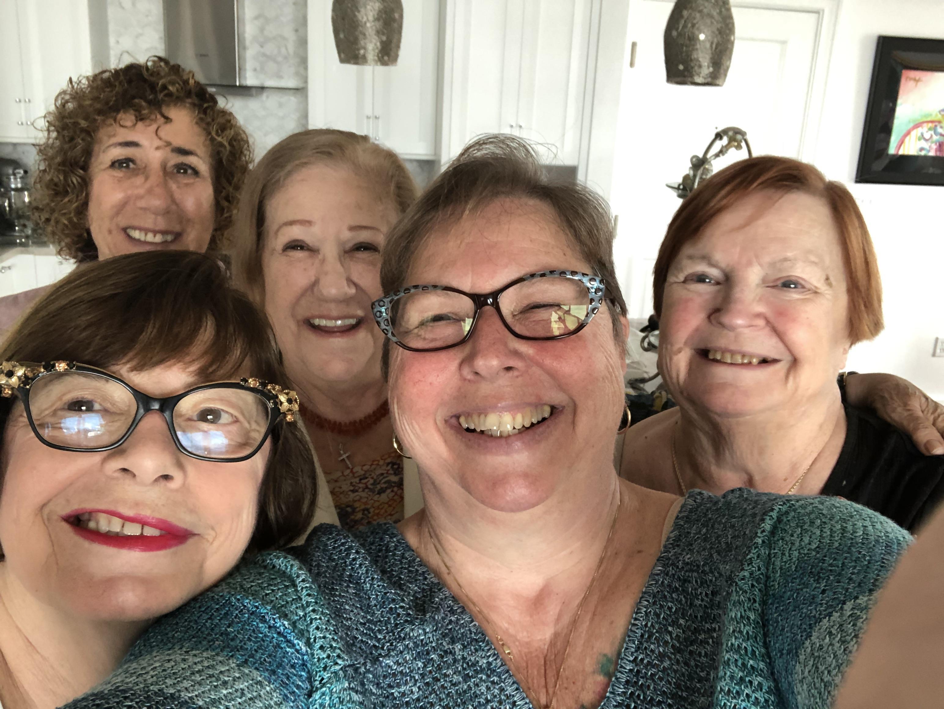 A group of women smiling for a selfie