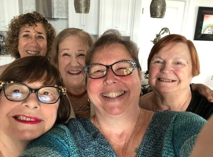 A group of women smiling for a selfie