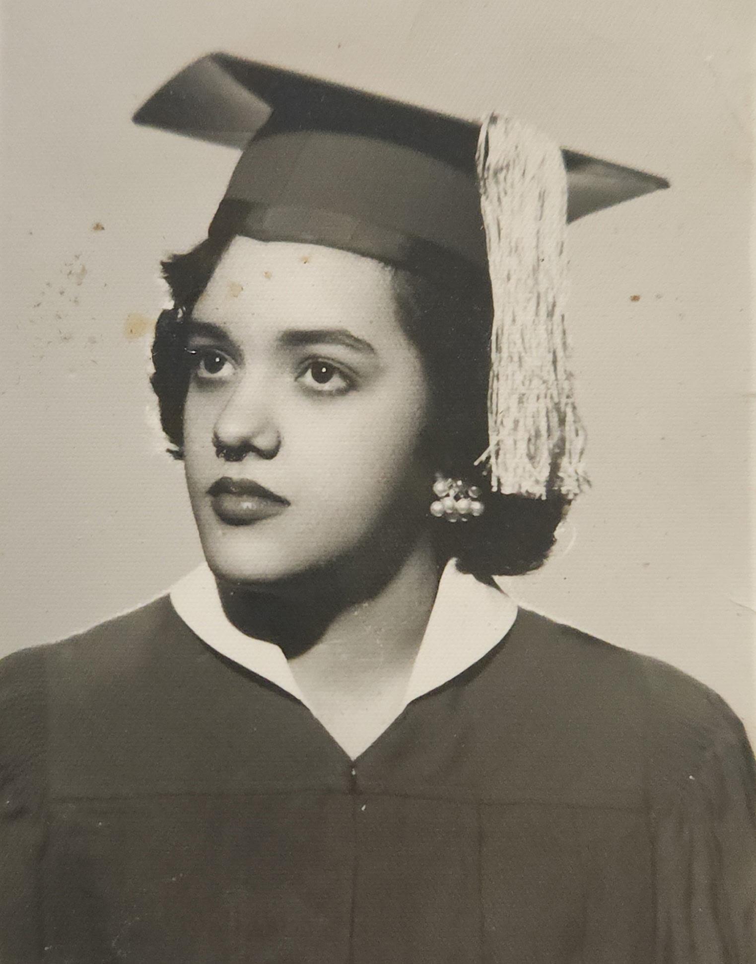 A woman in a graduation gown
