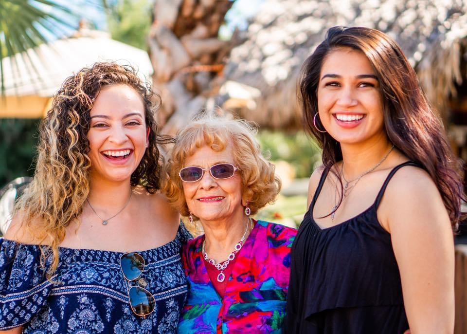 A group of women smiling for a picture