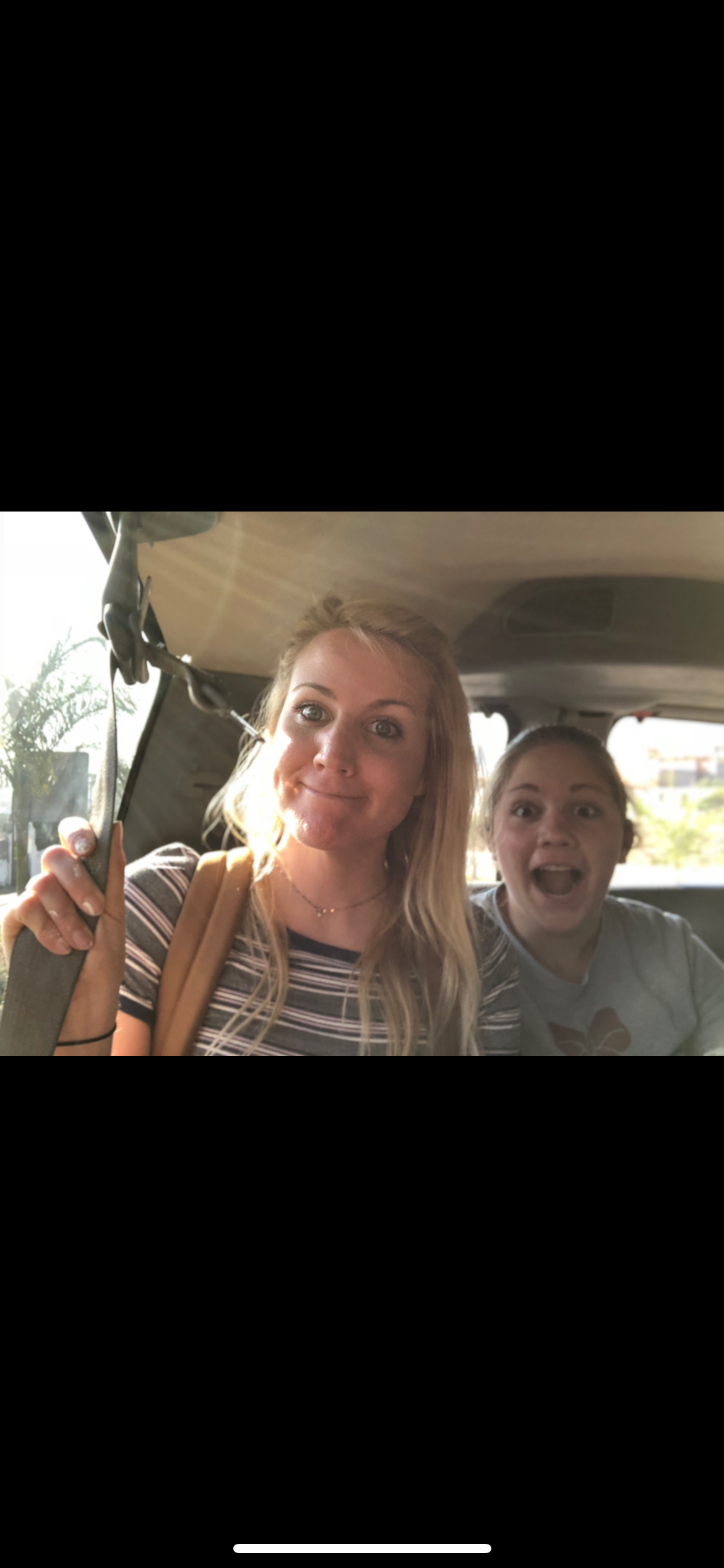 A selfie of two women in a car