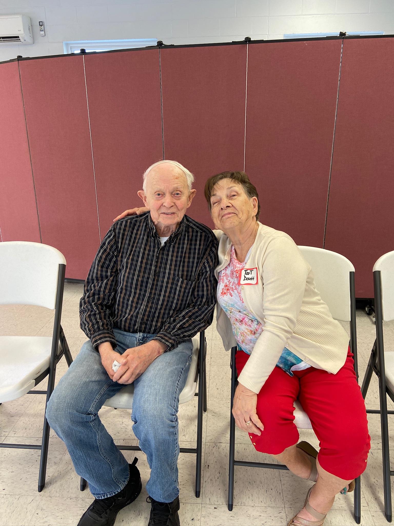 A man and woman sitting in chairs
